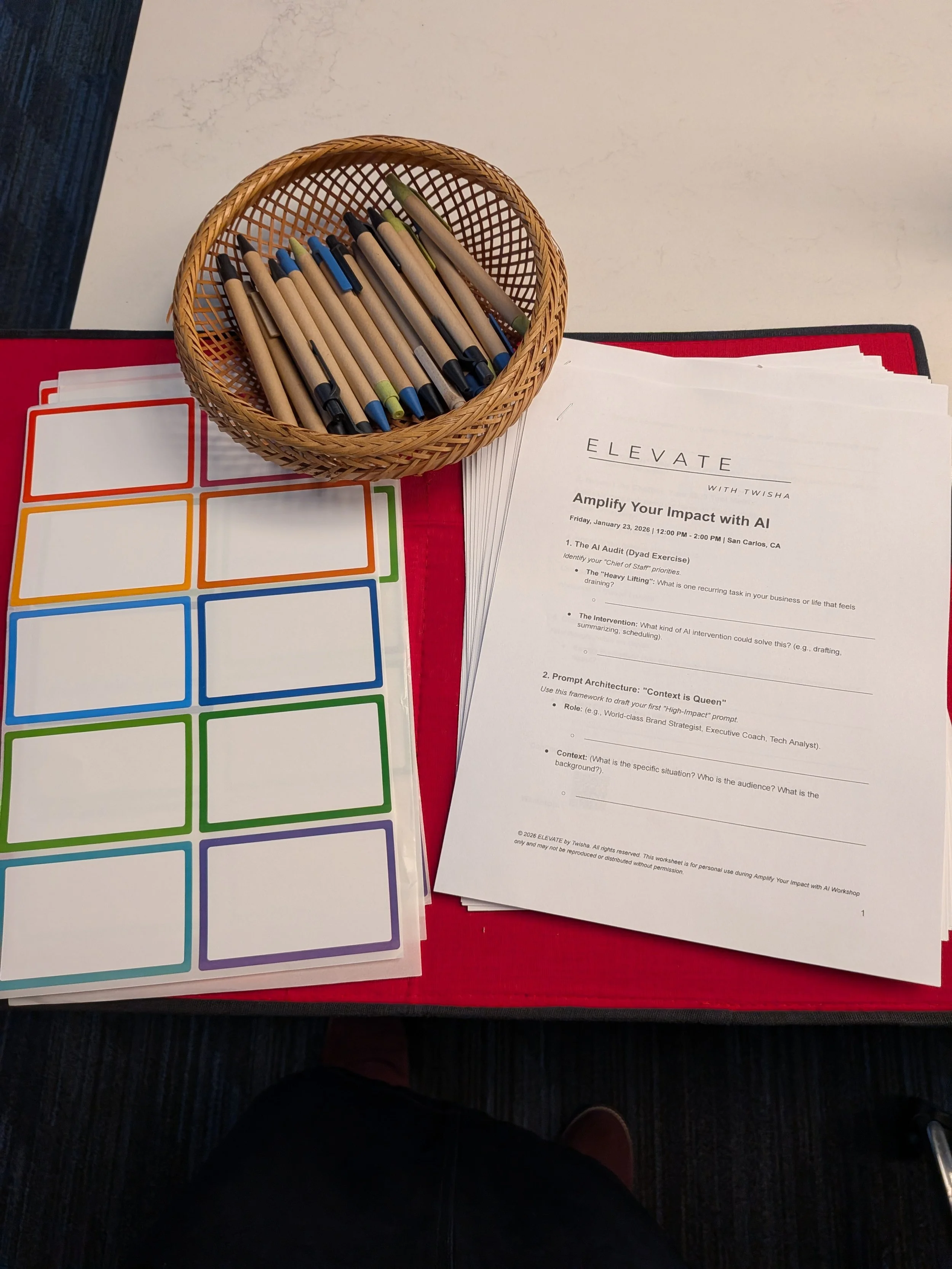 Pens, labels, worksheets for Twisha's AI workshop