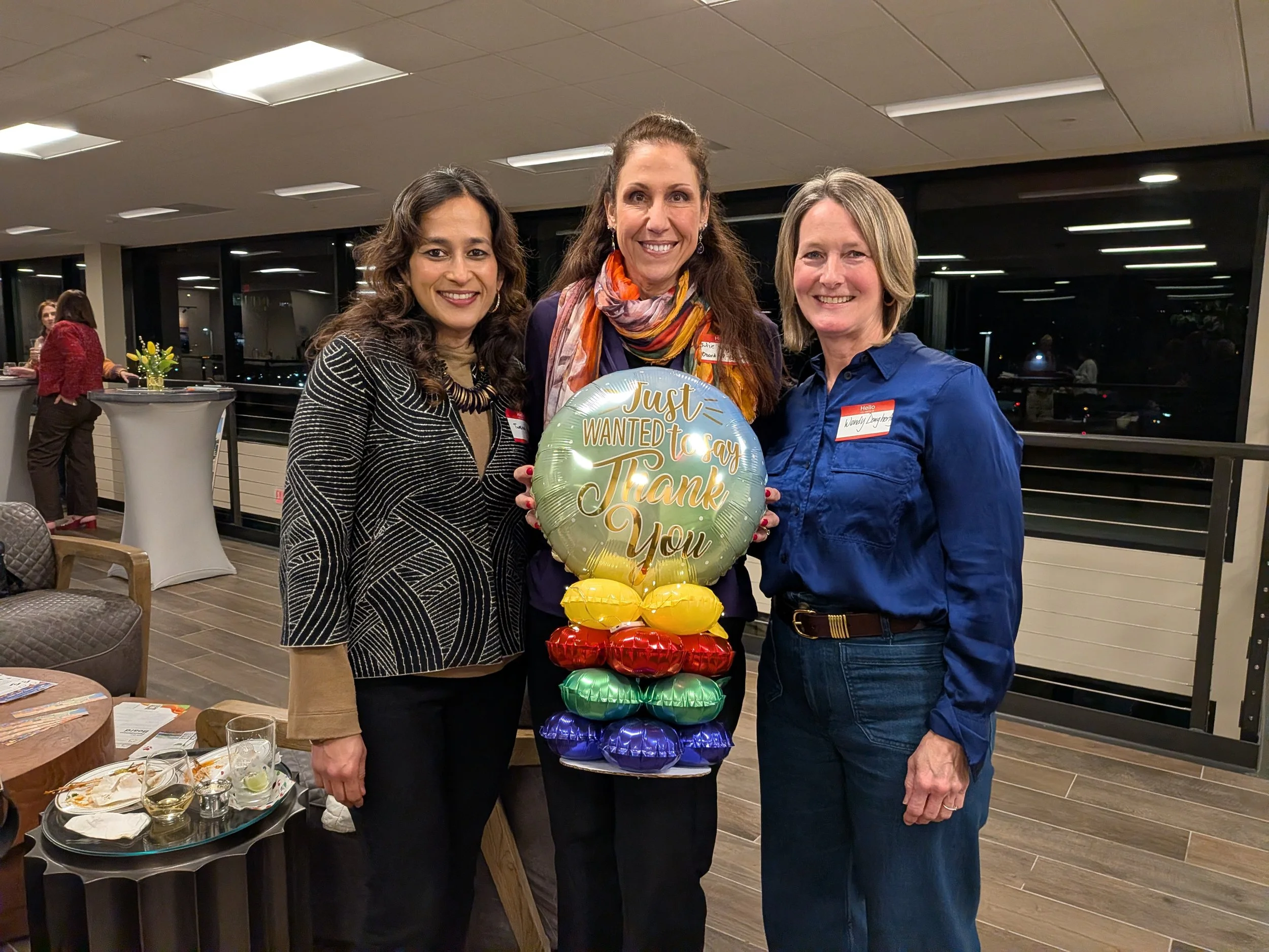 Professional in-person networking at a local coffee shop, demonstrating the ‘Human Premium’ and the value of face-to-face connection for remote executive leaders.