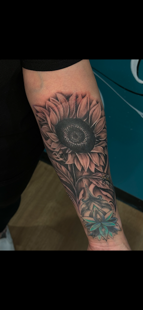 realism
realistic tattoo
black and grey tattoo
sunflower
sunflower tattoo
tattoo cover up
cover up tattoo