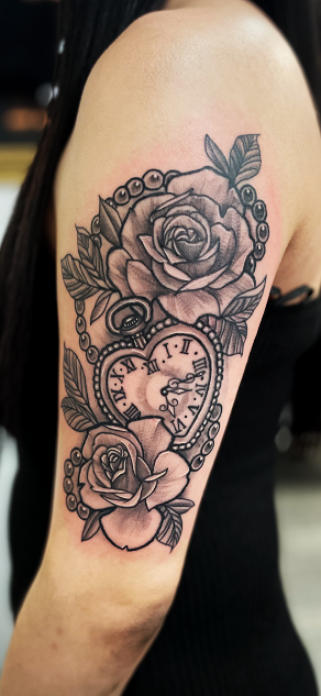 Girl tattoos with clock and roses