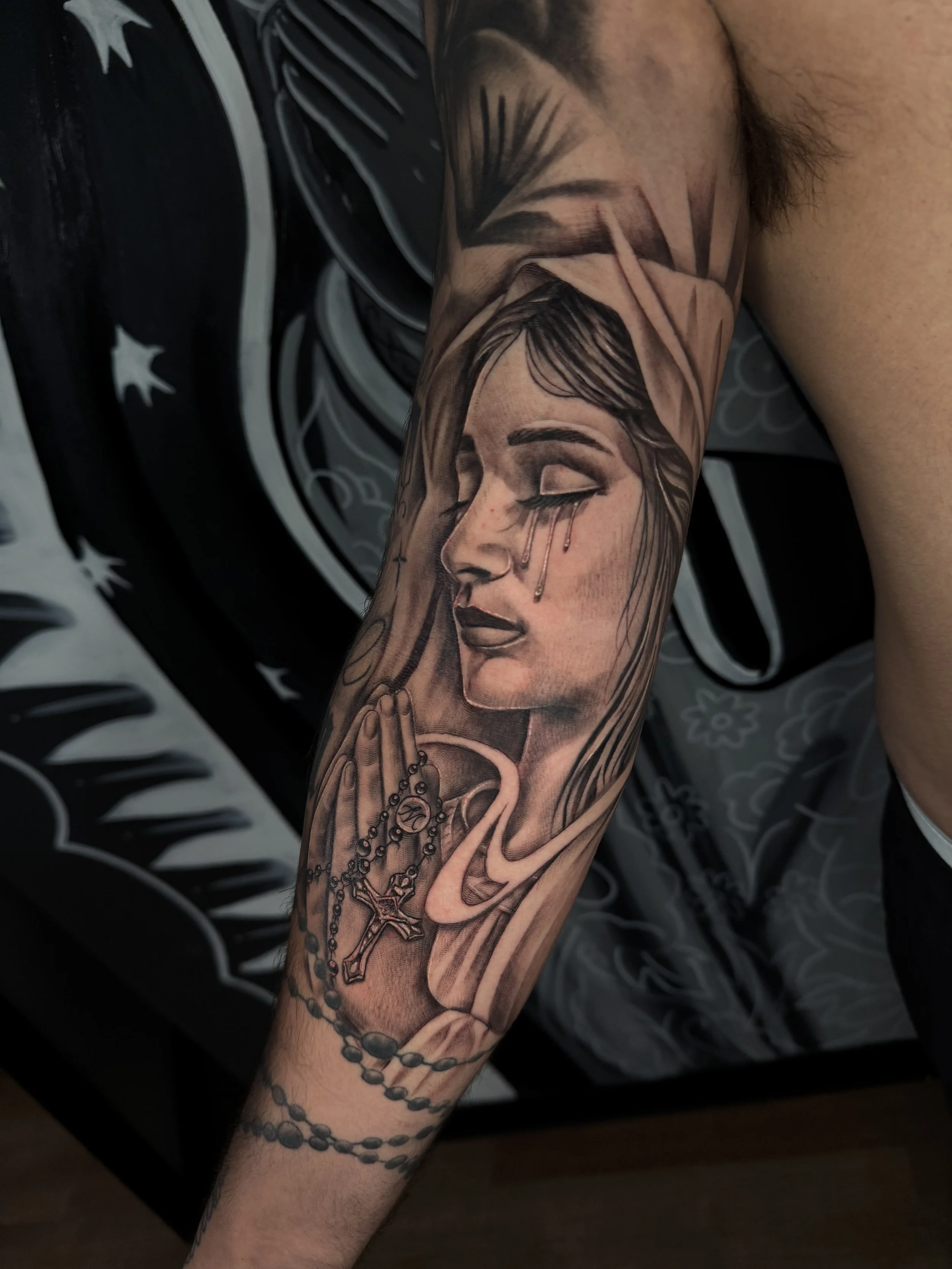 Virgin Mary tattoo by Beyond the Lines tattoo artist Julio.
