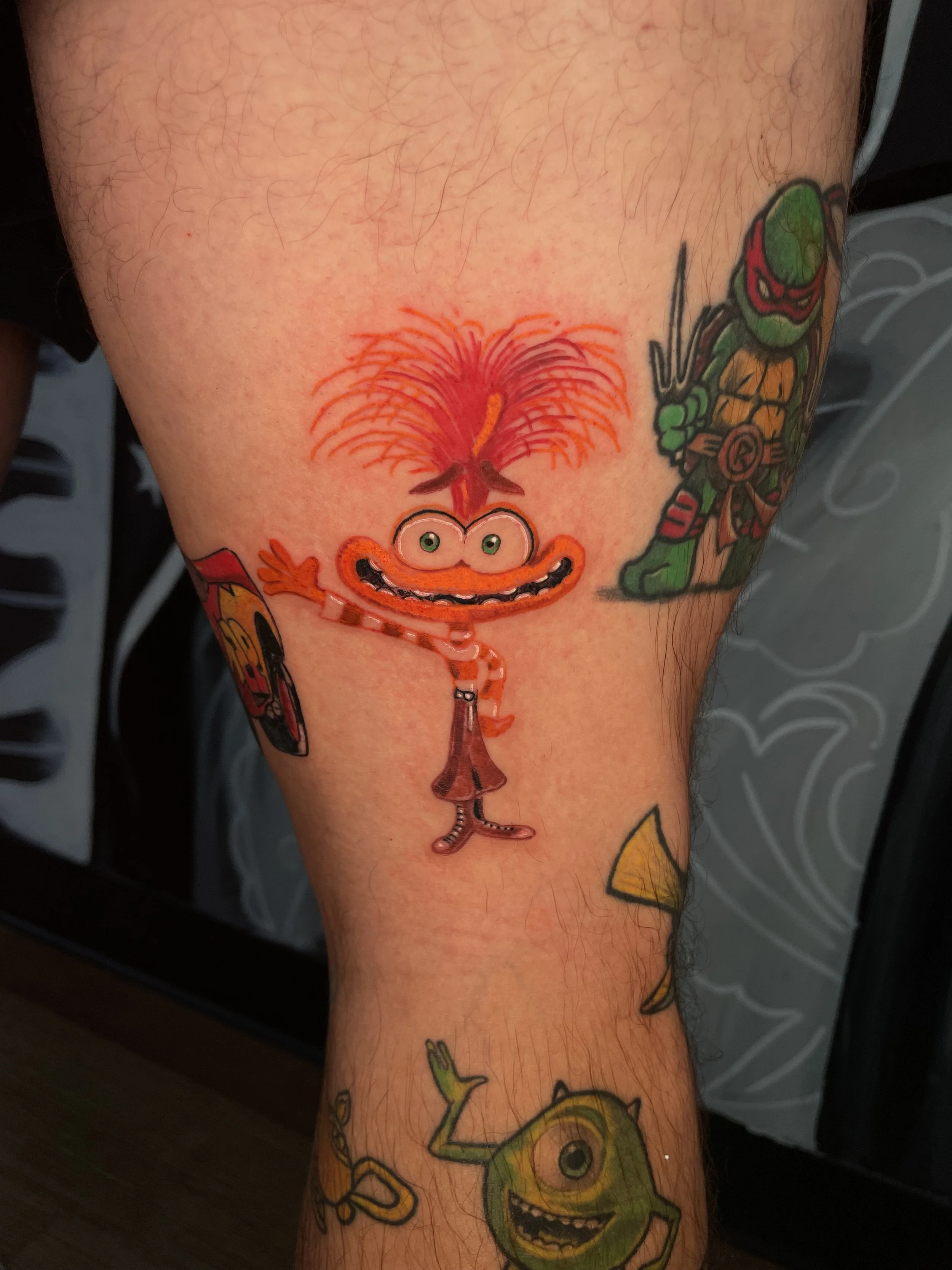 Bright colorful Anxiety character tattoo done by Aaron LInaje in Austin, Texas.