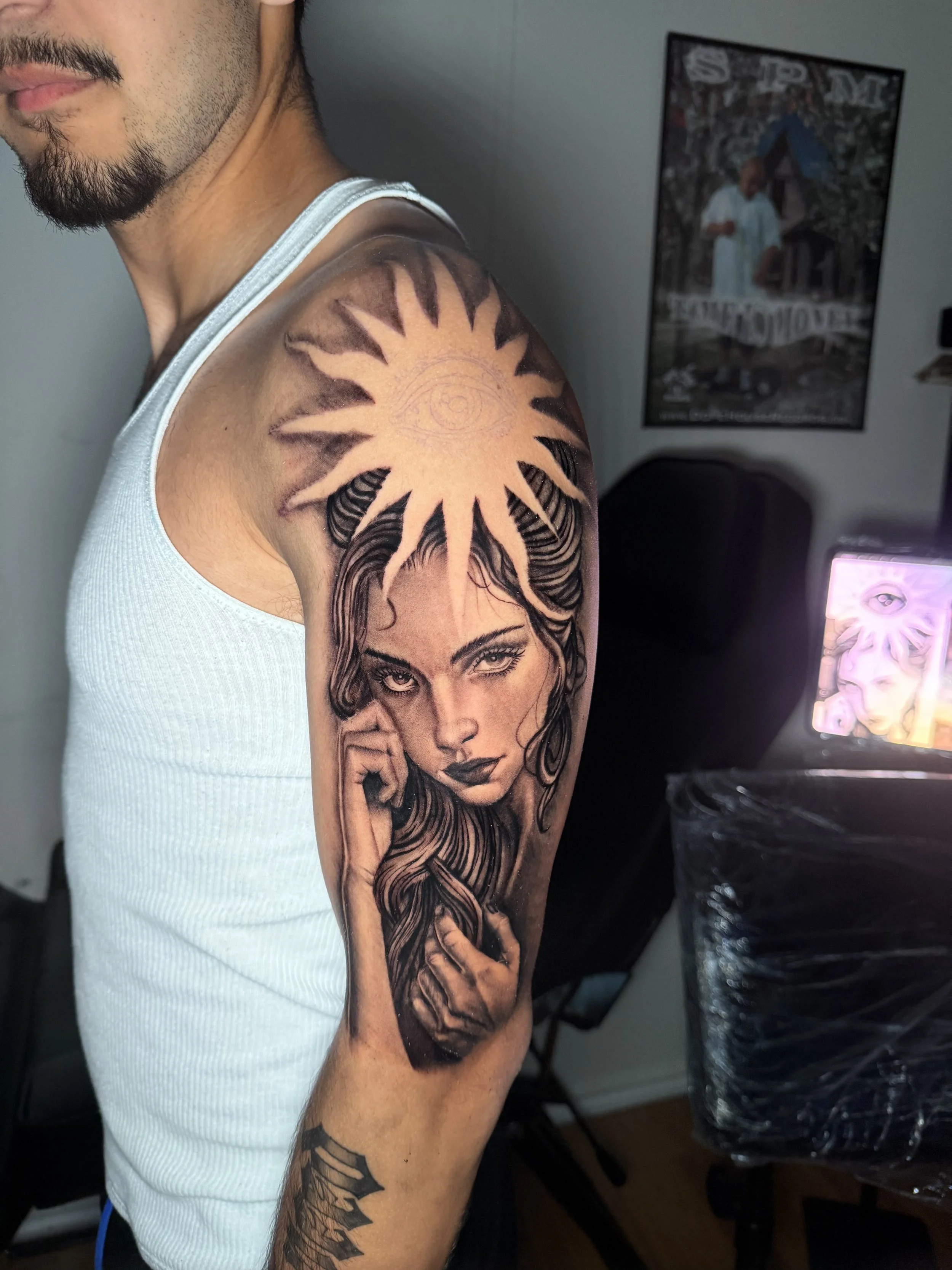 Black and grey portrait tattoo by Oscar.