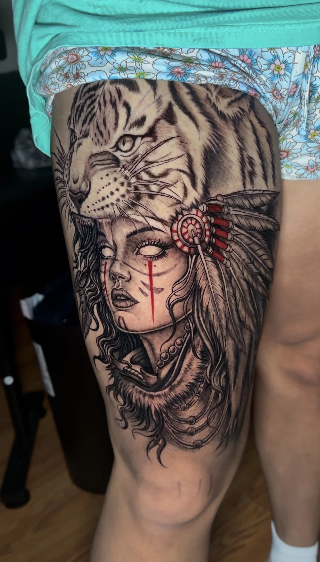 lady warrior wearing a tiger headdress tattoo by Oscar.