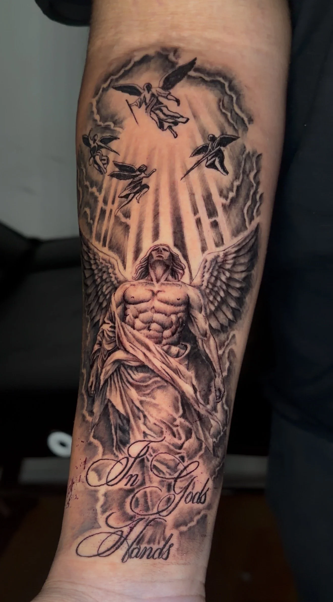 Angelic tattoo done in black and grey realism by Oscar 