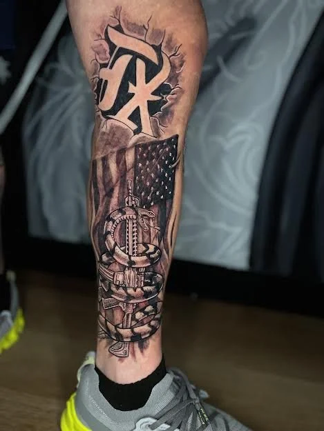 Texas with American flag and AR15 rifle with snake done in black and grey tattoo.