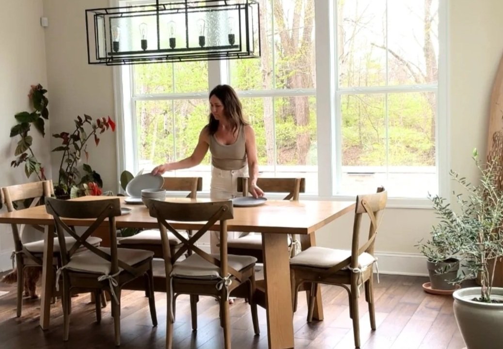 woman setting kitchen table