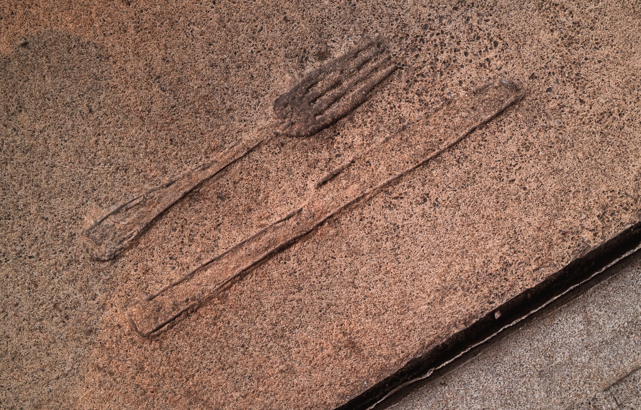 Close-up of brushed metal surface with scratches.