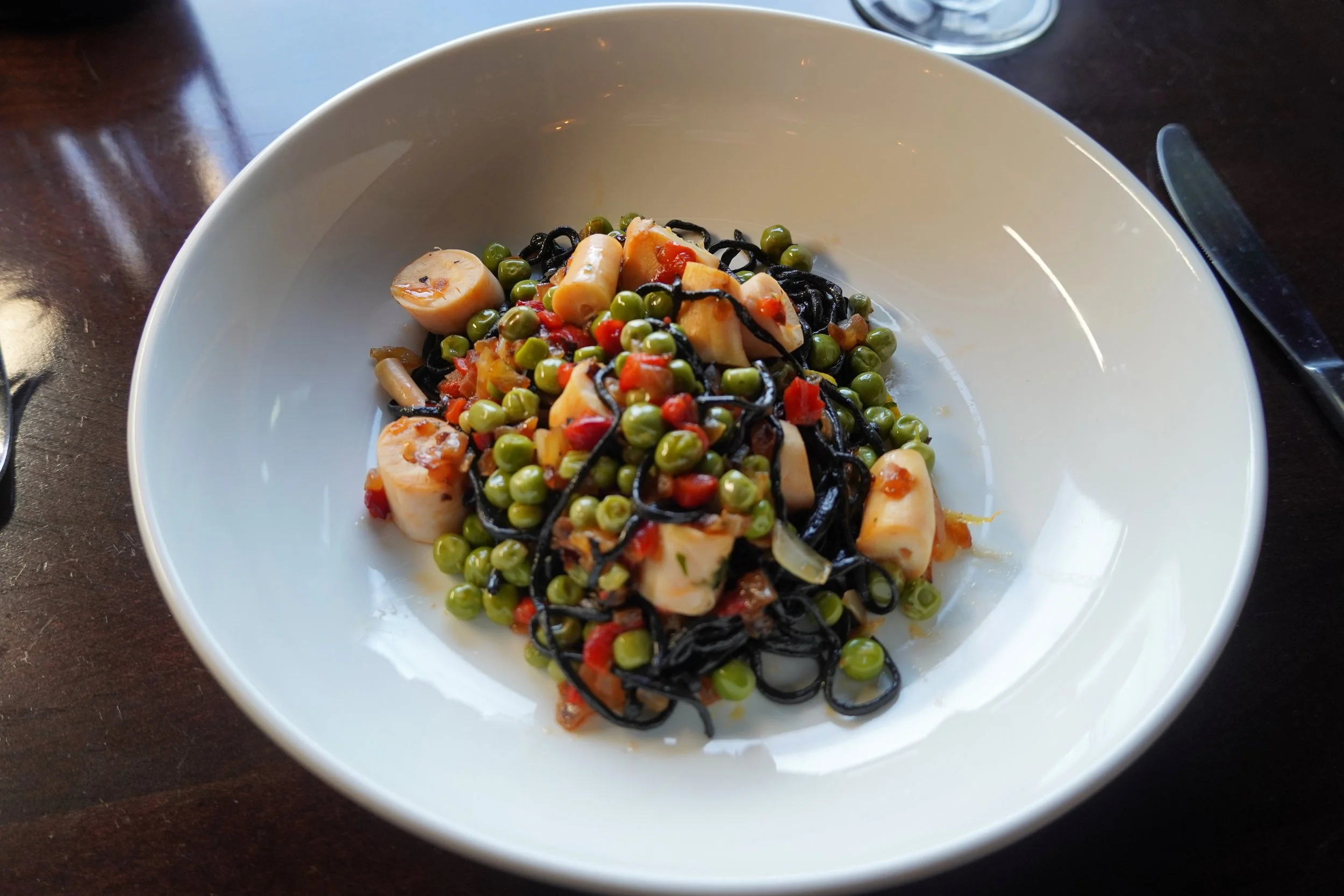 squid ink angel hair pasta, charred octopus sofrito and English peas.JPG