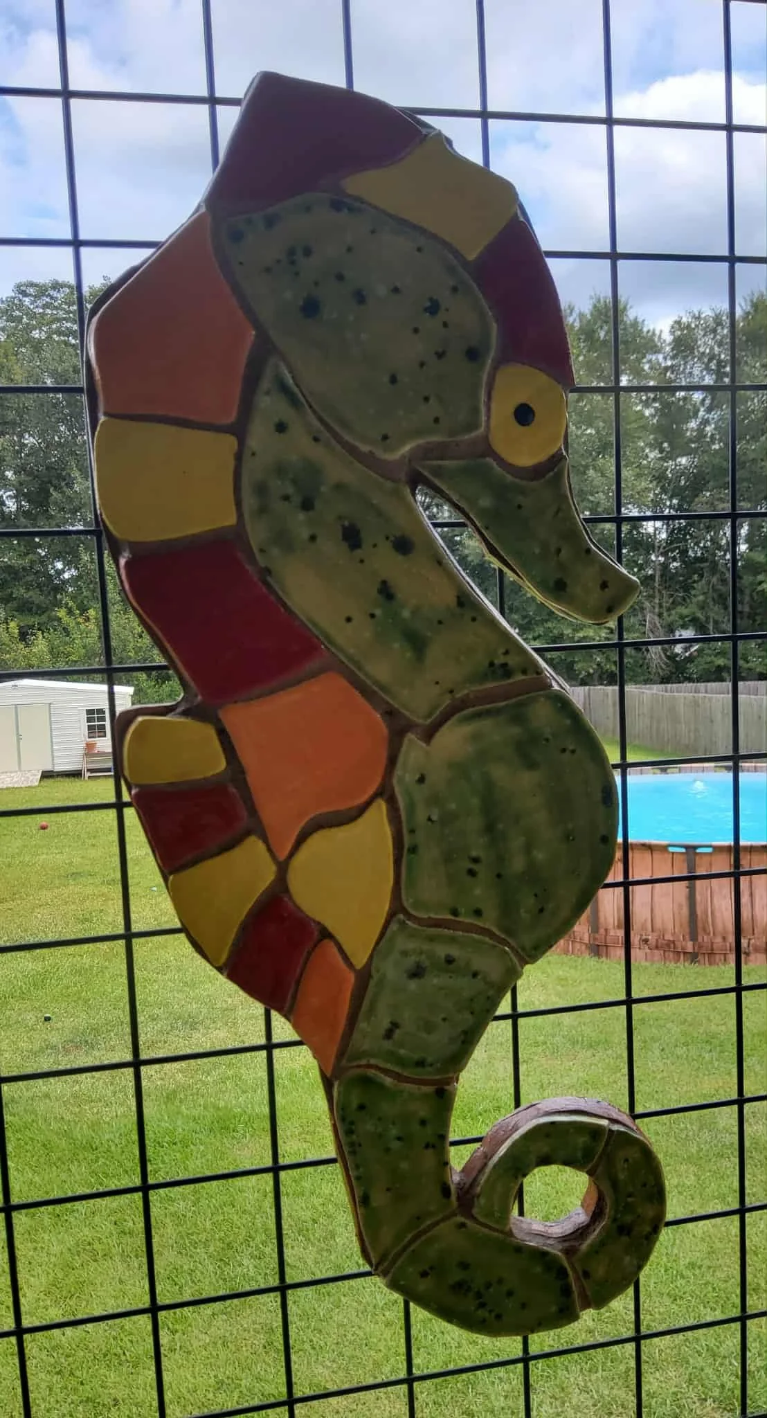 Sunny the Seahorse $125 Size is 8" wide x 18.5" high Made of ceramic tile backed with wood for hanging