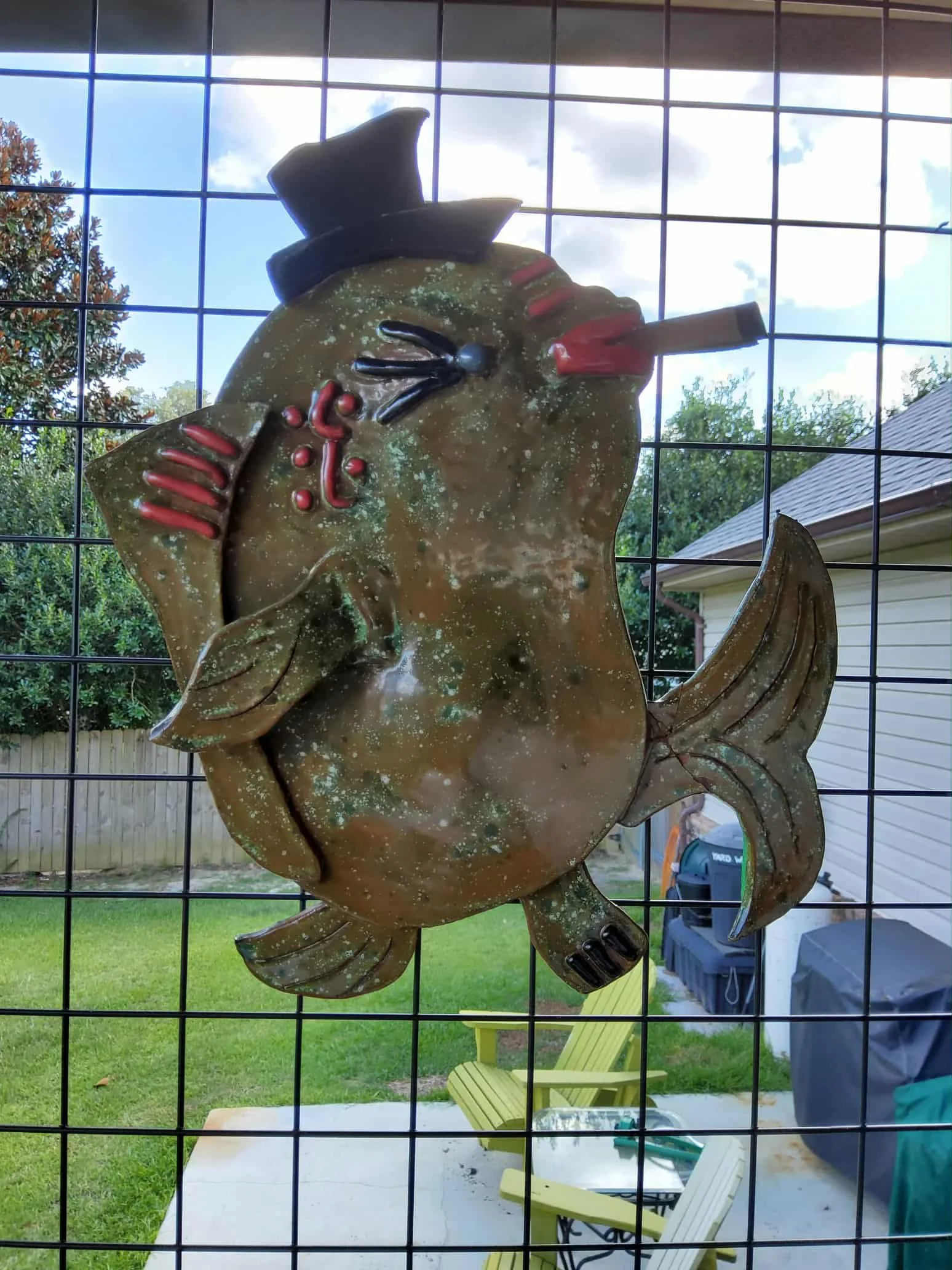 Smokin Joe $145 Size is 12" wide x 14" high Made of ceramic tile backed with wood for hanging