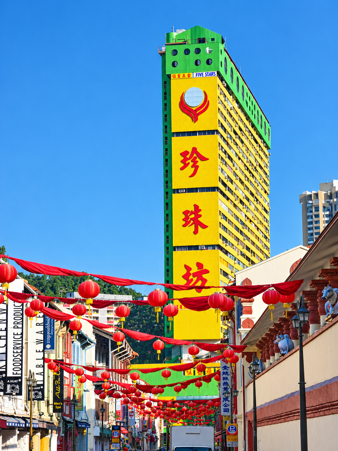 bright yellow building with Chinese Lanterns in the foreground