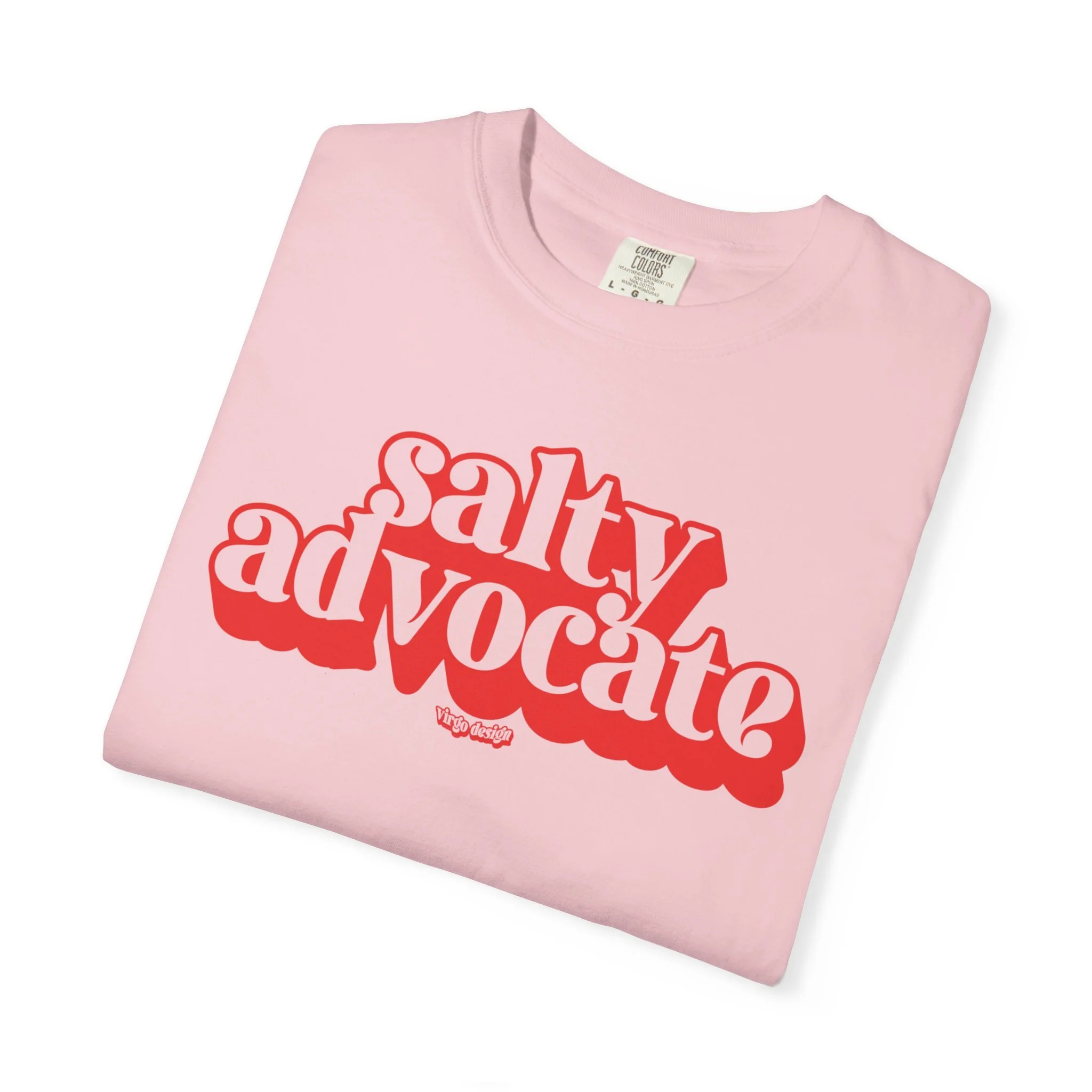 folded pink t-shirt with red text that reads salty advocate
