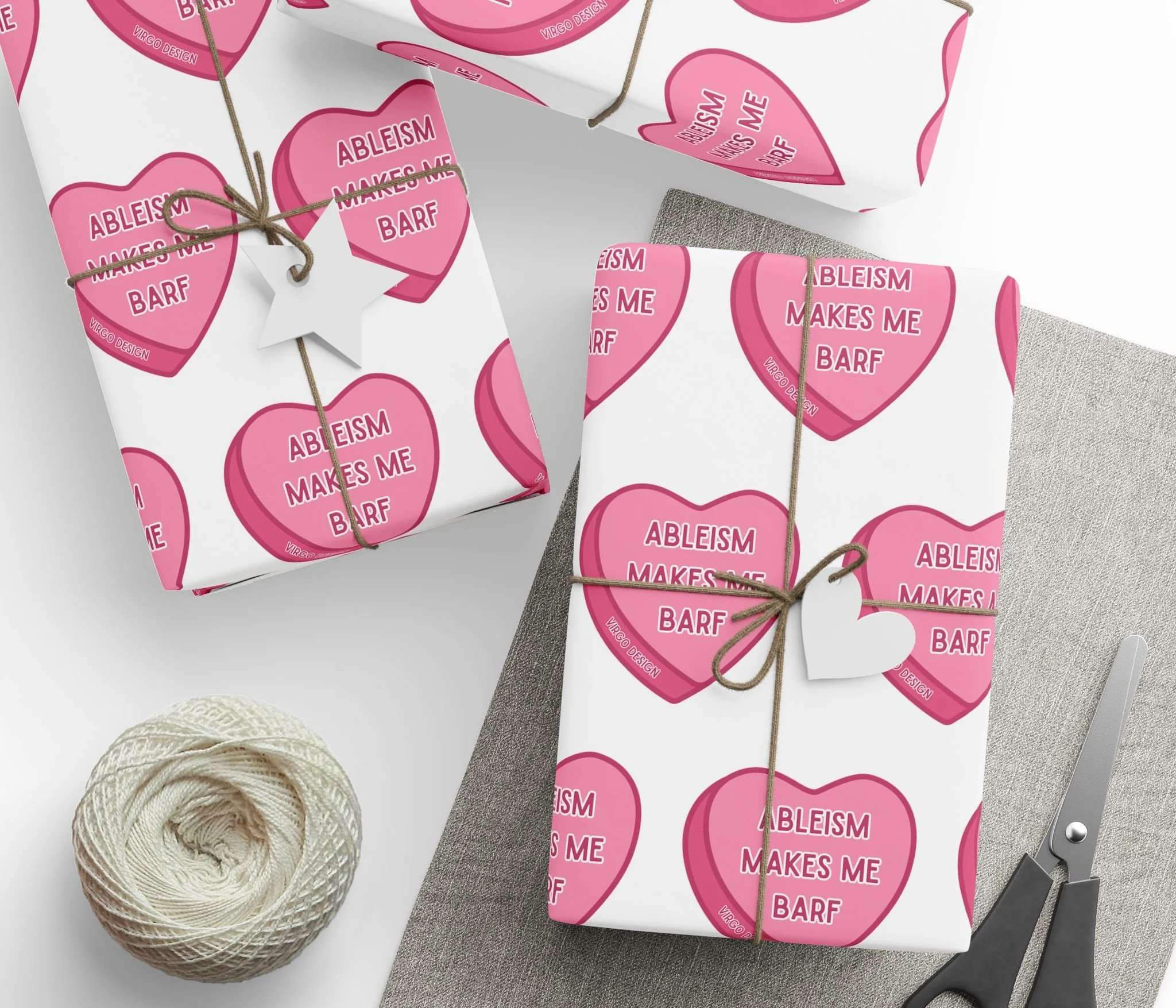 ableism makes me barf candy heart wrapping paper in pink and white