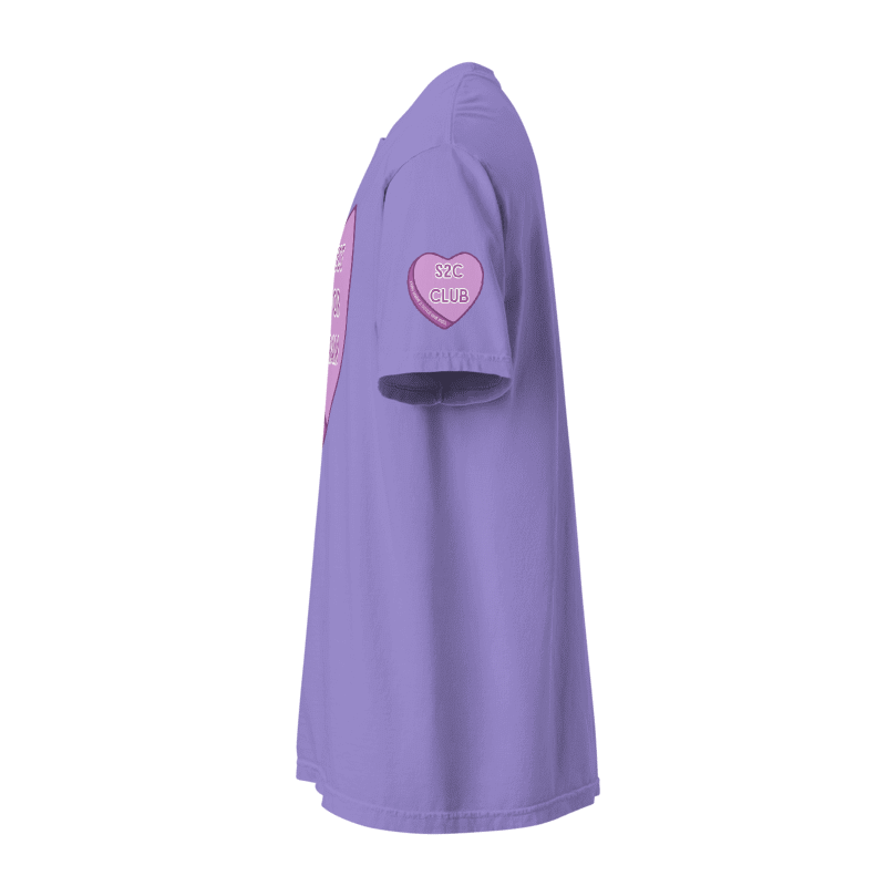 side view of the sleeve detail purple tee featuring a virgo design + watch gigi spell collaboration with a purple candy heart that says, 's2c club'
