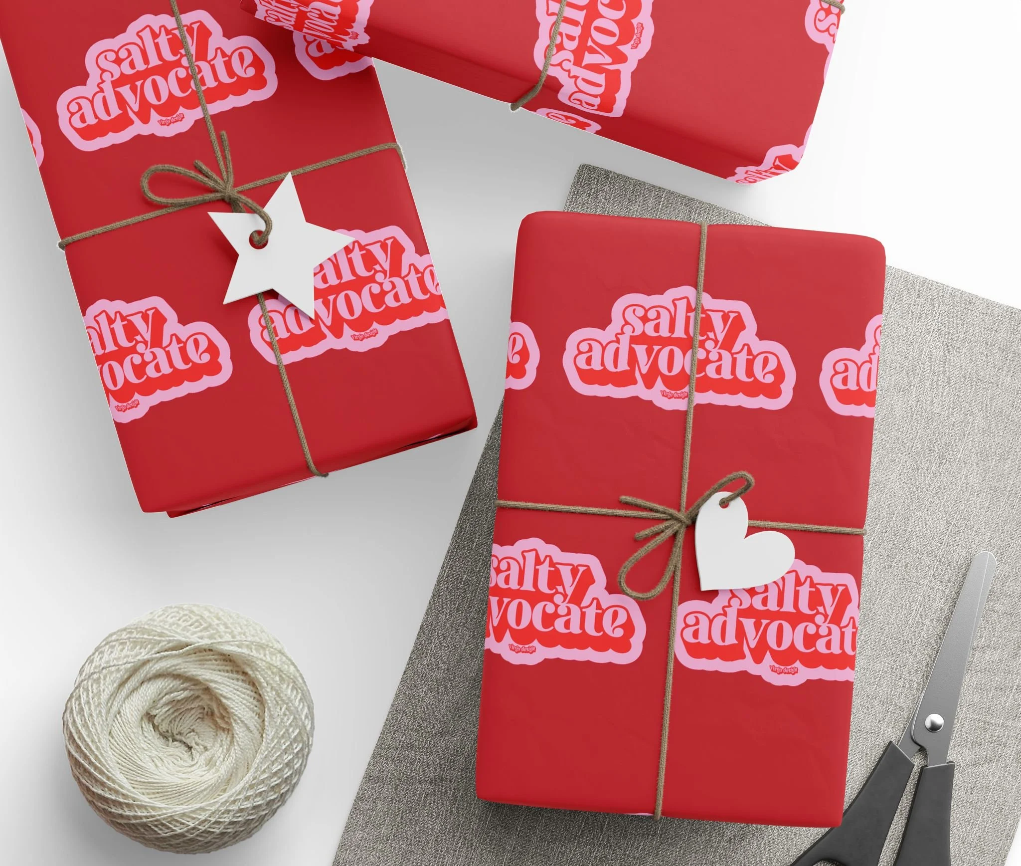salty advocate wrapping paper in pink and red