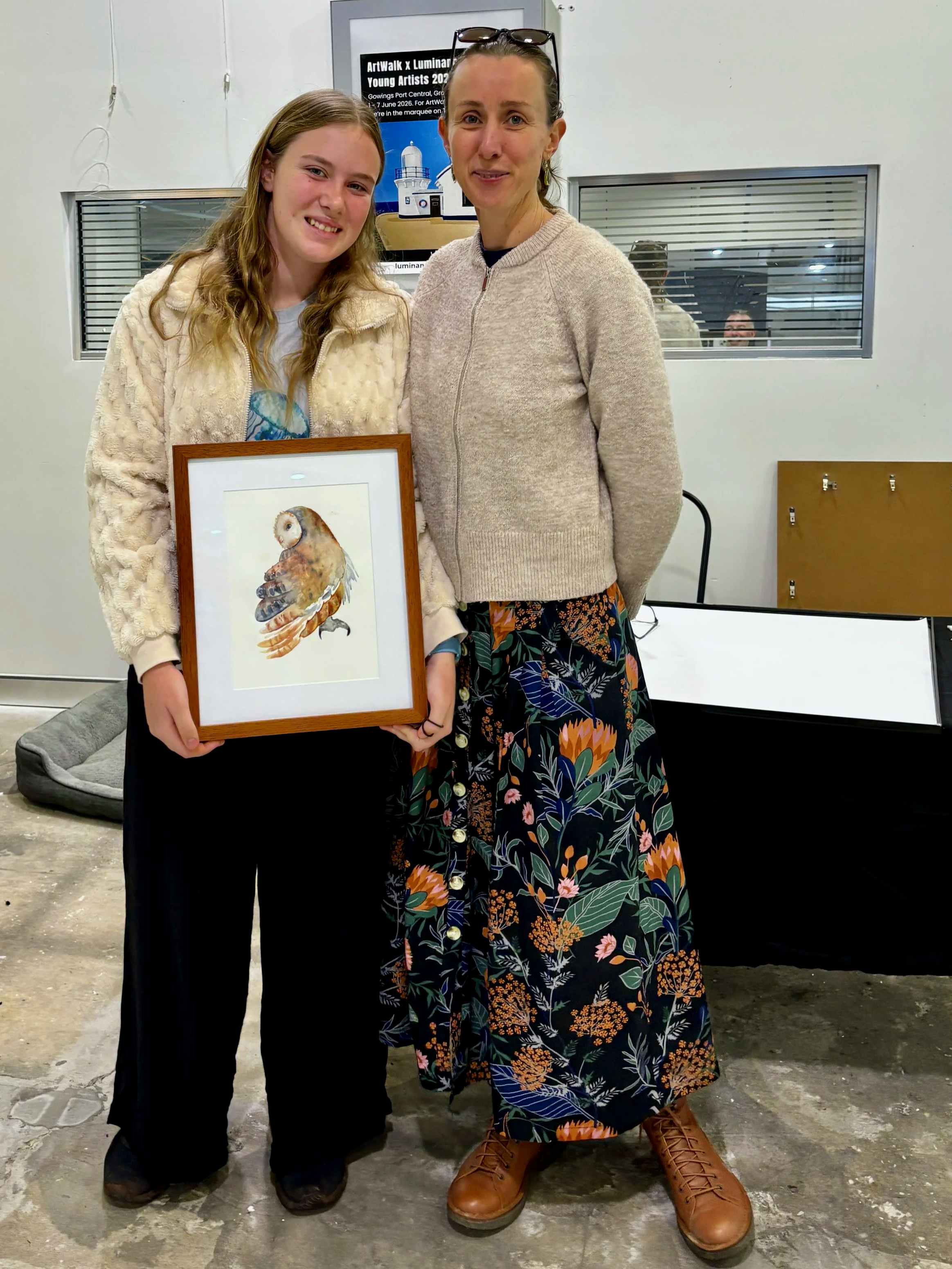 Young artist Wren McDowell with Oneewa McDowell and 'Blue Feathers'.