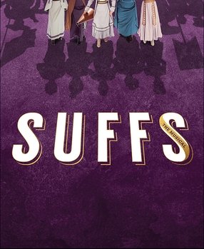 People dressed as the characters from the musical 'The Adams Family' with cast shadows on purple carpeting, and the word 'SUFFS' in large white letters on the floor.