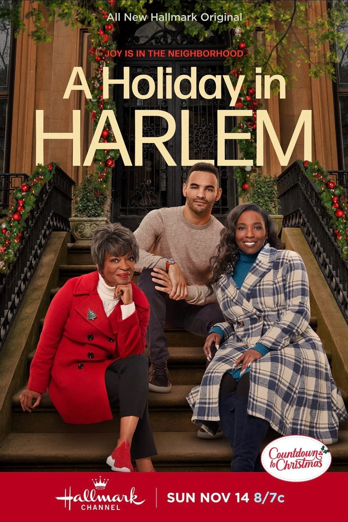 Promotional poster for a holiday movie titled "A Holiday in Harlem", featuring three people sitting on the front steps of a decorated building with Christmas garlands and ornaments. The poster mentions the Hallmark Channel and the date Sunday, November 14 at 8/7c.