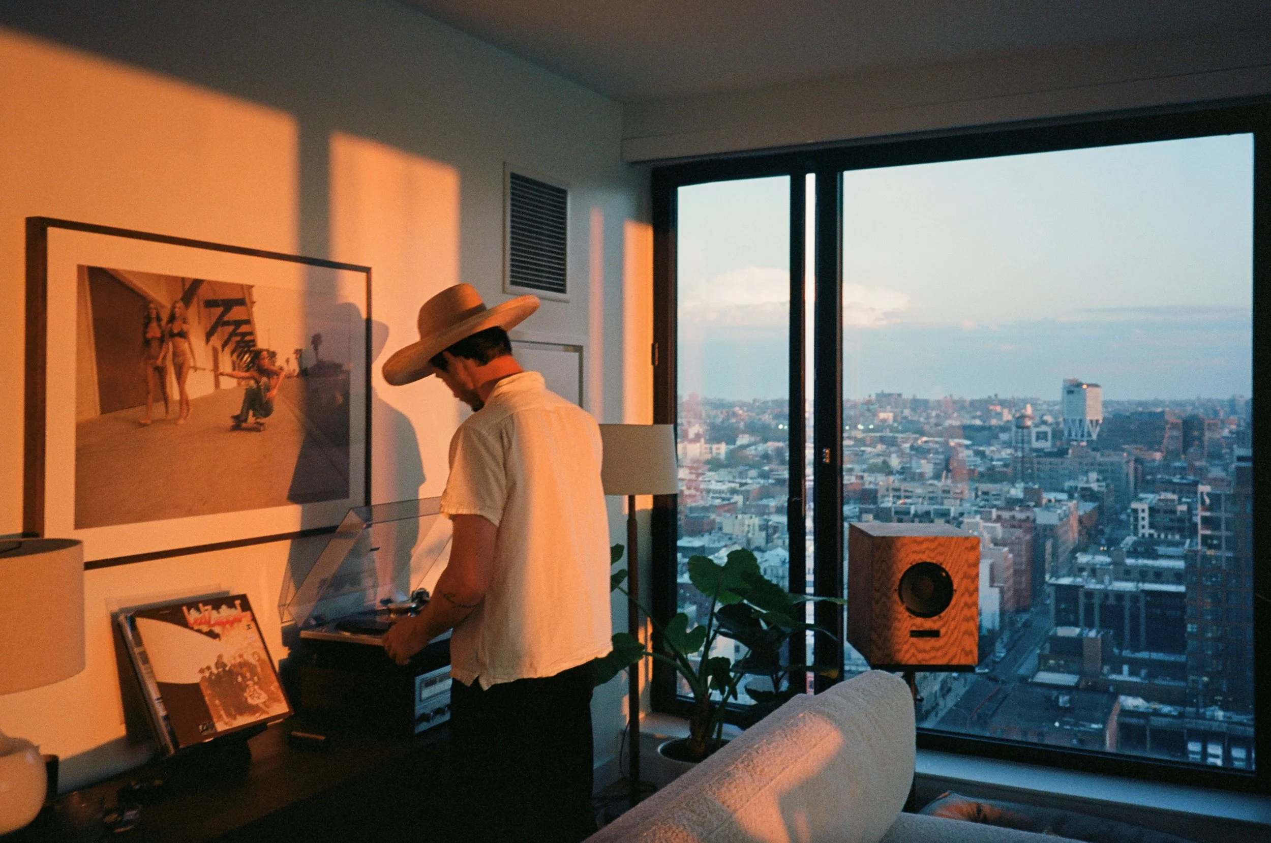Vinyl records and New York skyline at sunset