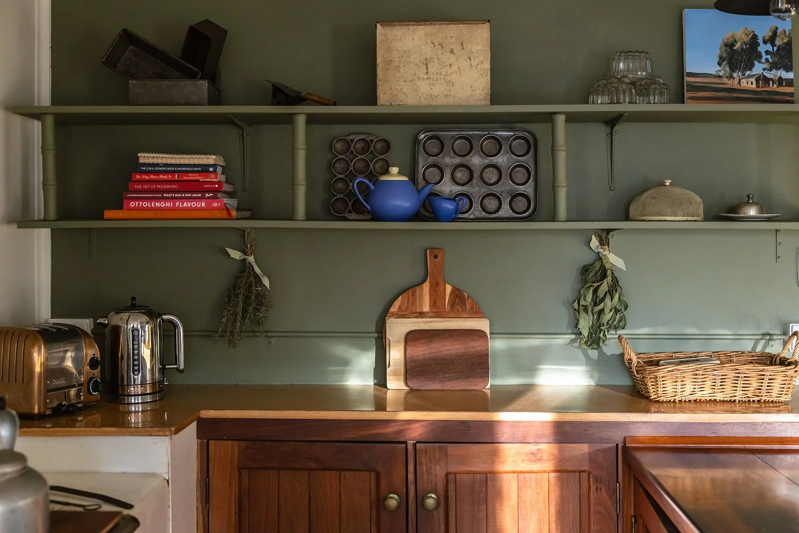 Sunny Hill's kitchen in full of kitchen charm - old baking tins, glass jelly moulds and much more
