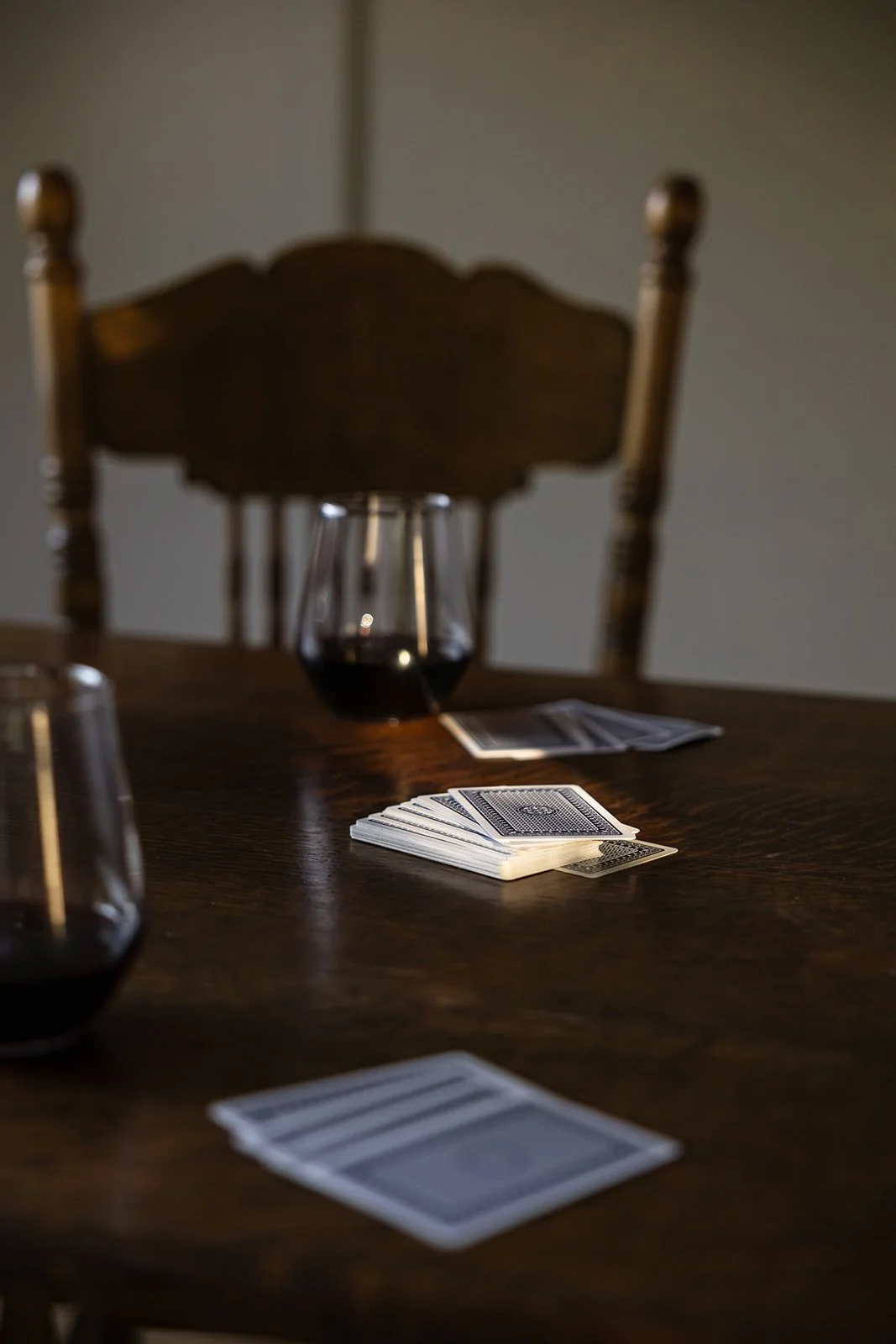A card game with red wine at the kitchen table of Sunny Hill