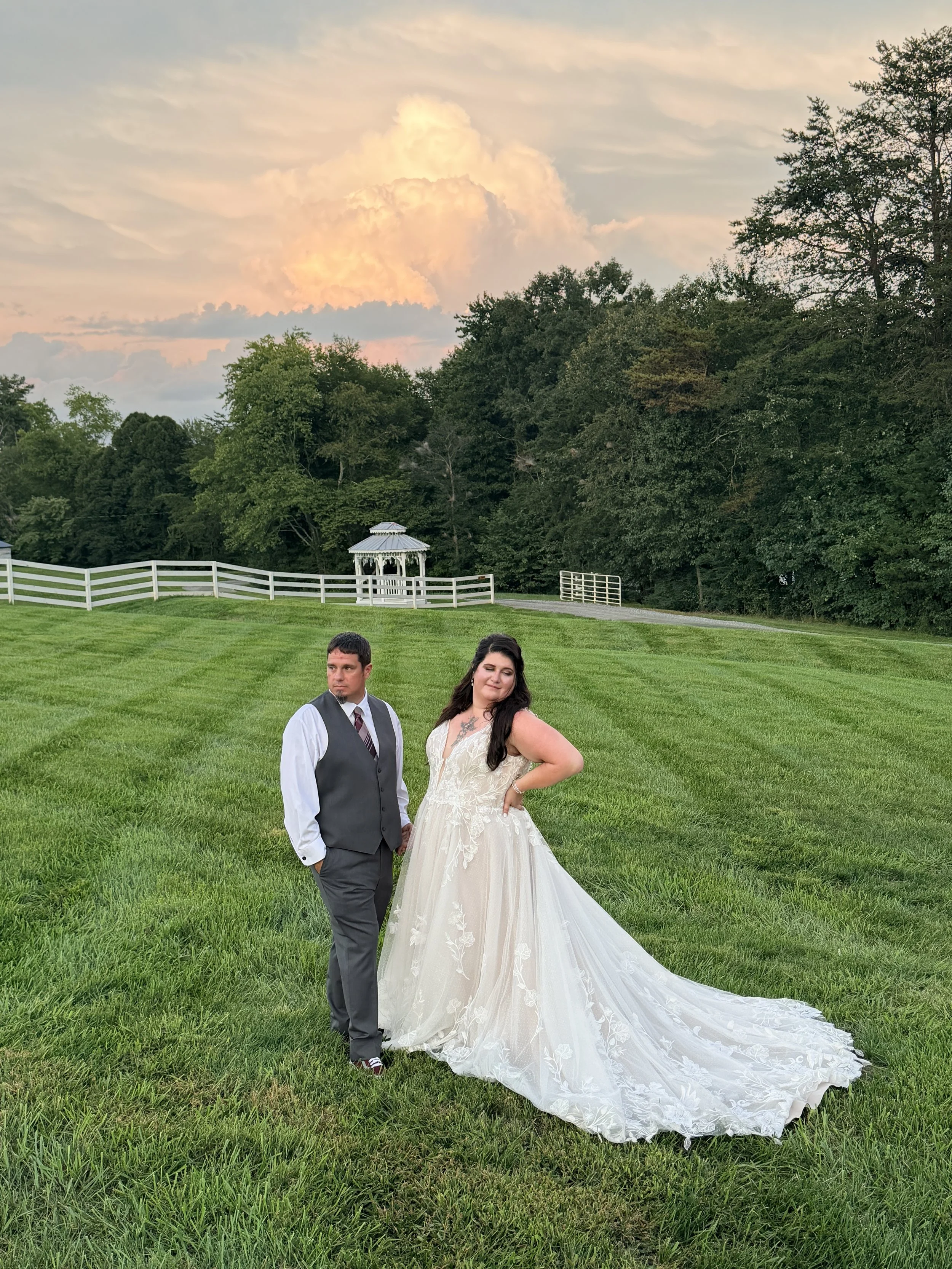 Bride and groom in meadow with gazebo at golden hour; Best Wedding Reviews Near Charlotte NC