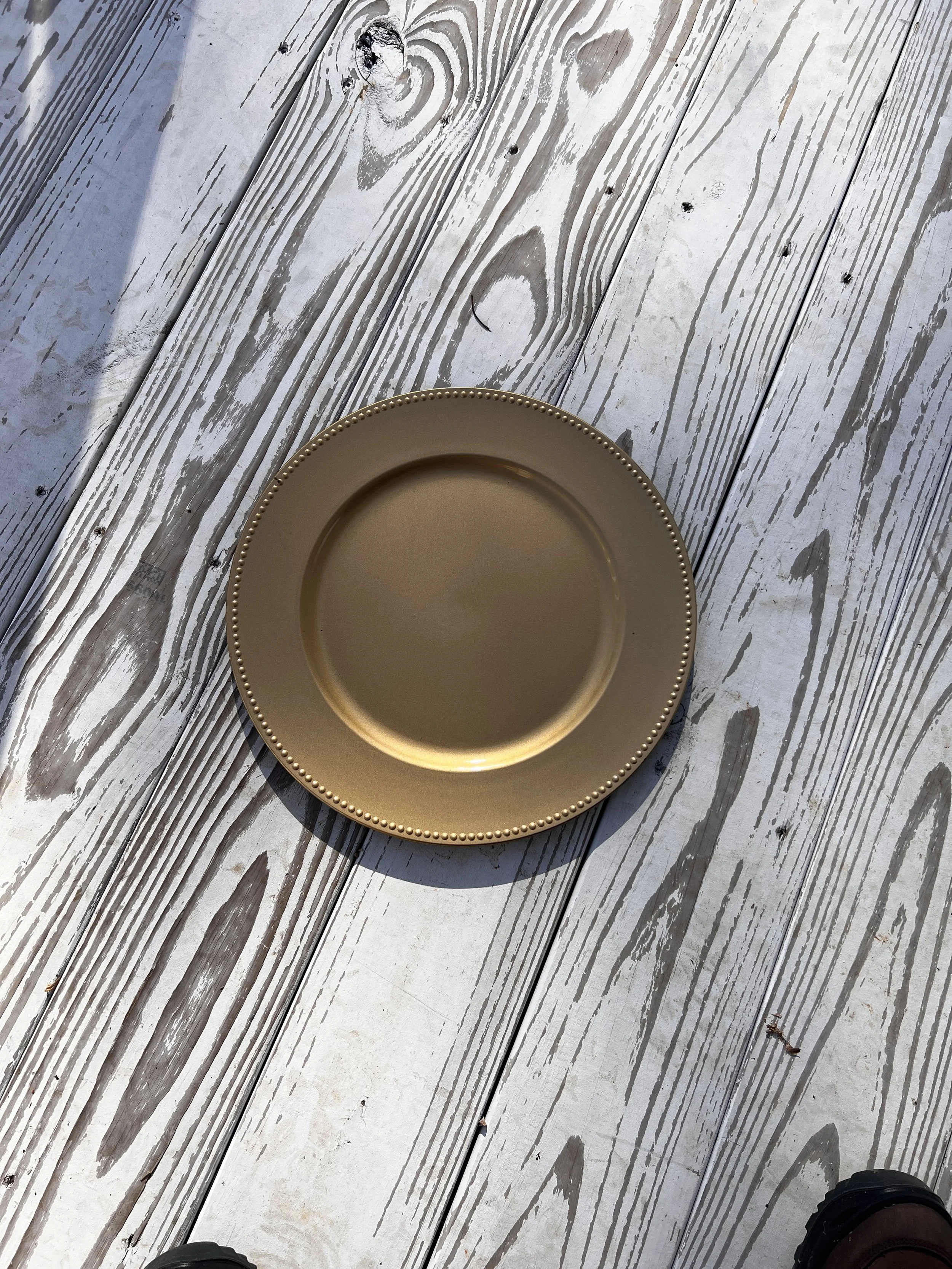 Gold charger plate with beaded edge for Charlotte wedding decorations