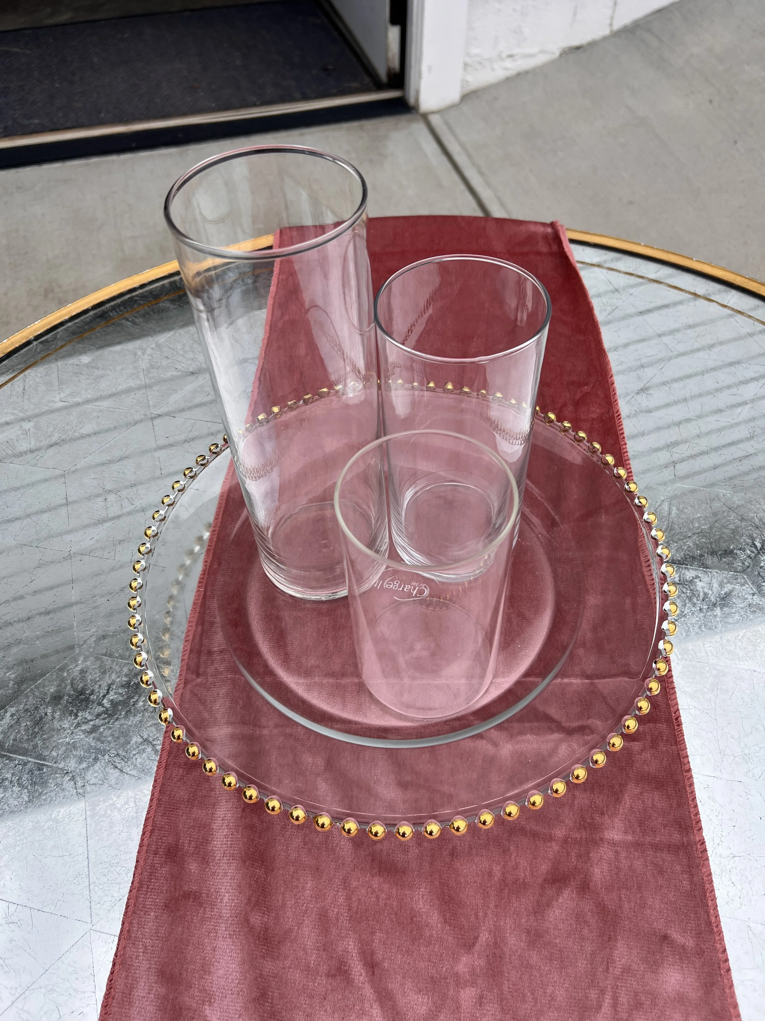Cylinder vases small medium and large on glass charger with gold beads for wedding