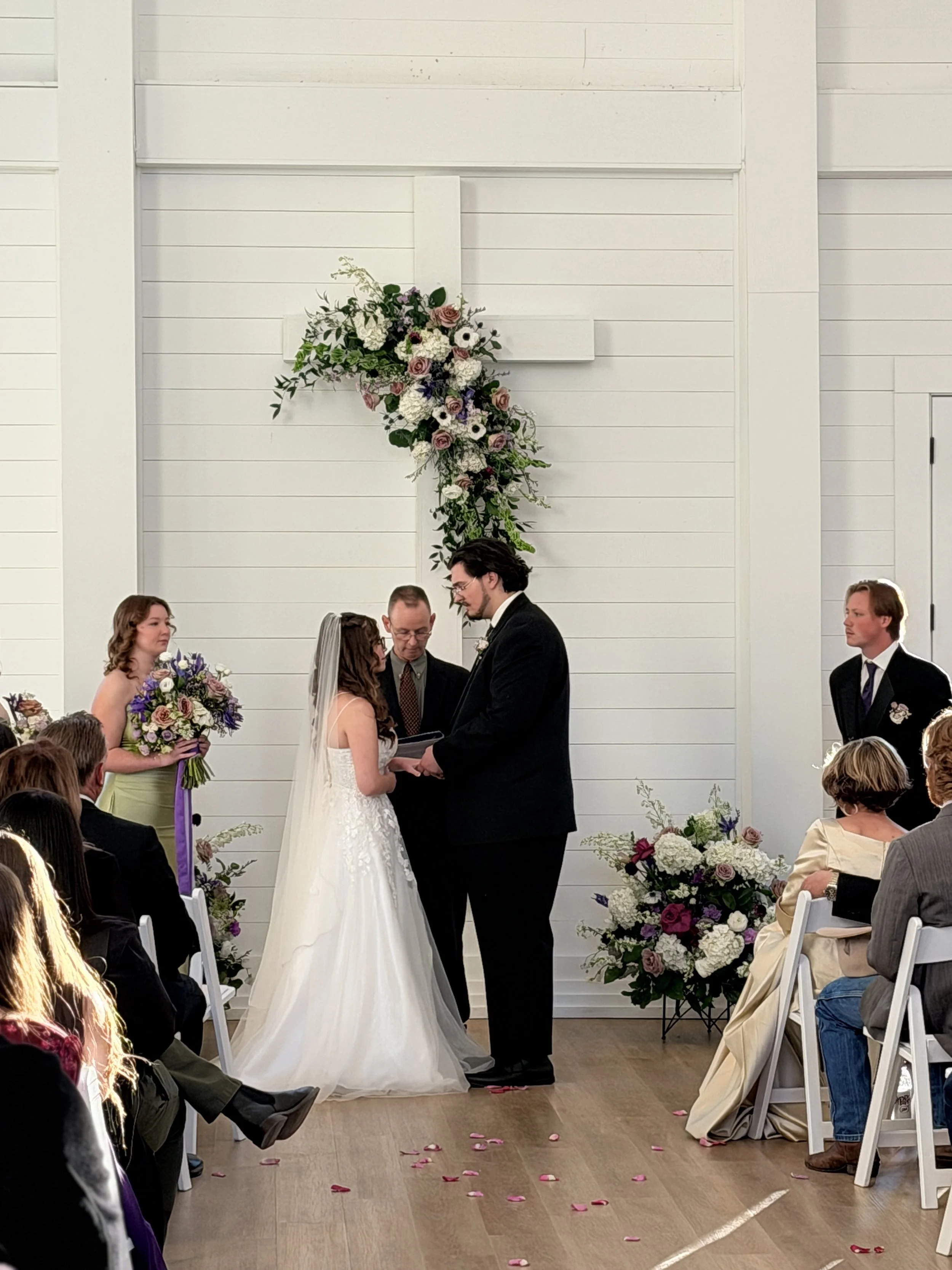 Bride and groom in white Charlotte wedding venue