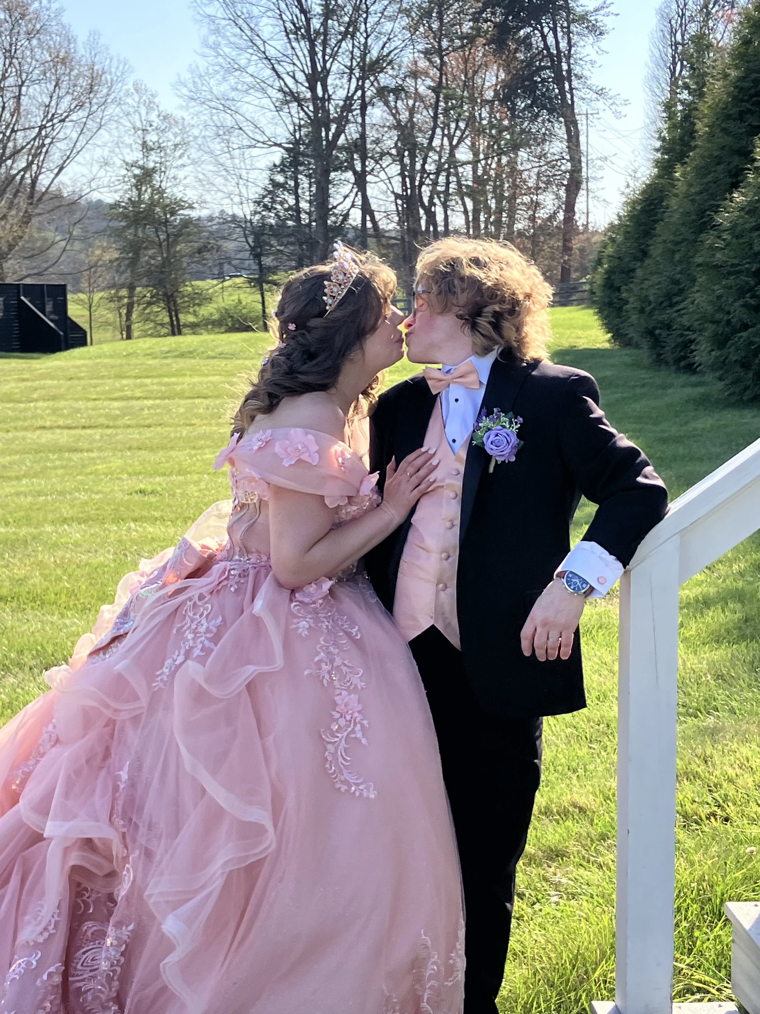 Bride and groom kissing at NC wedding venue; top questions to ask before booking a wedding venue in NC