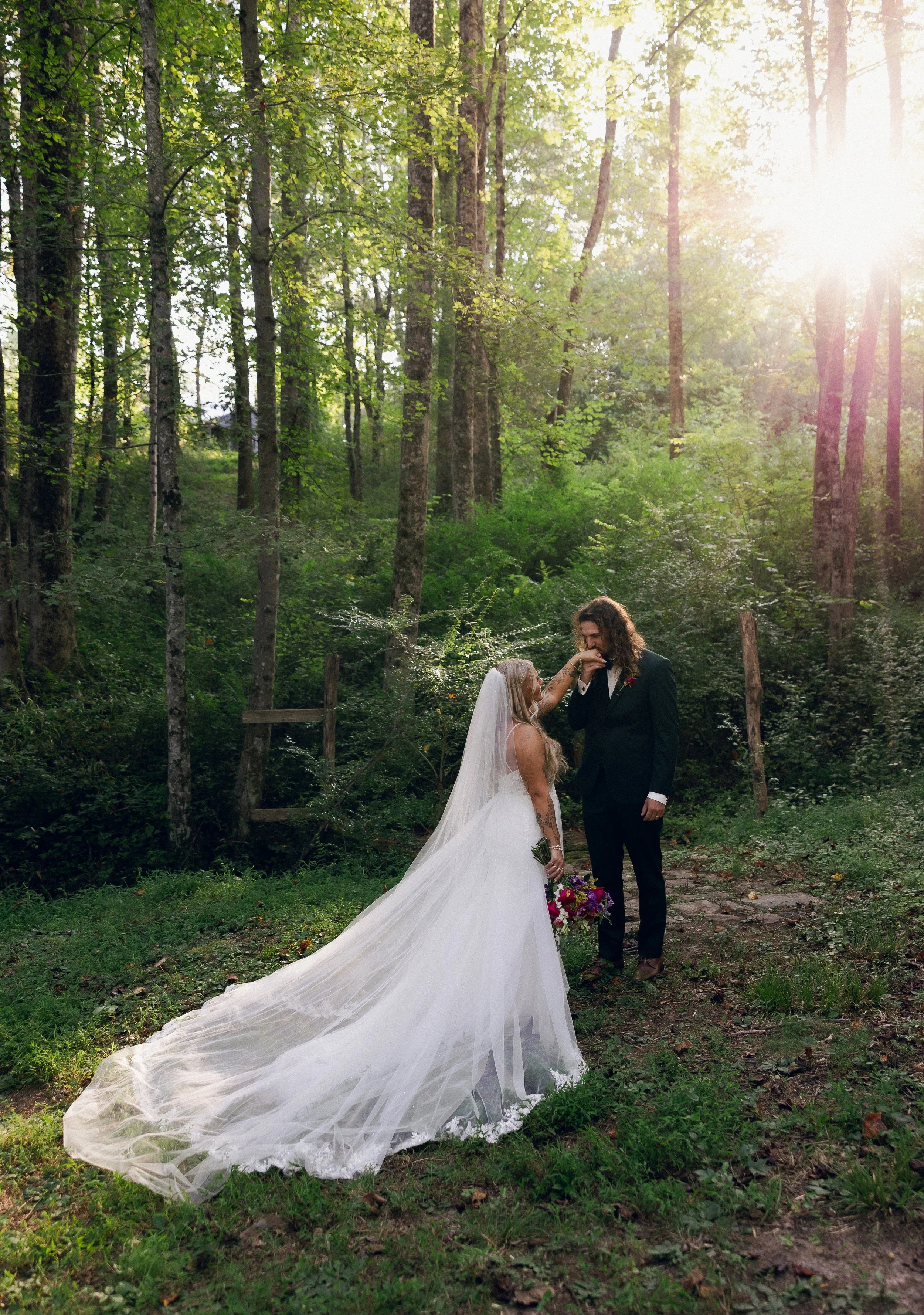 Bride and groom in enchanted forest at a Charlotte wedding venue