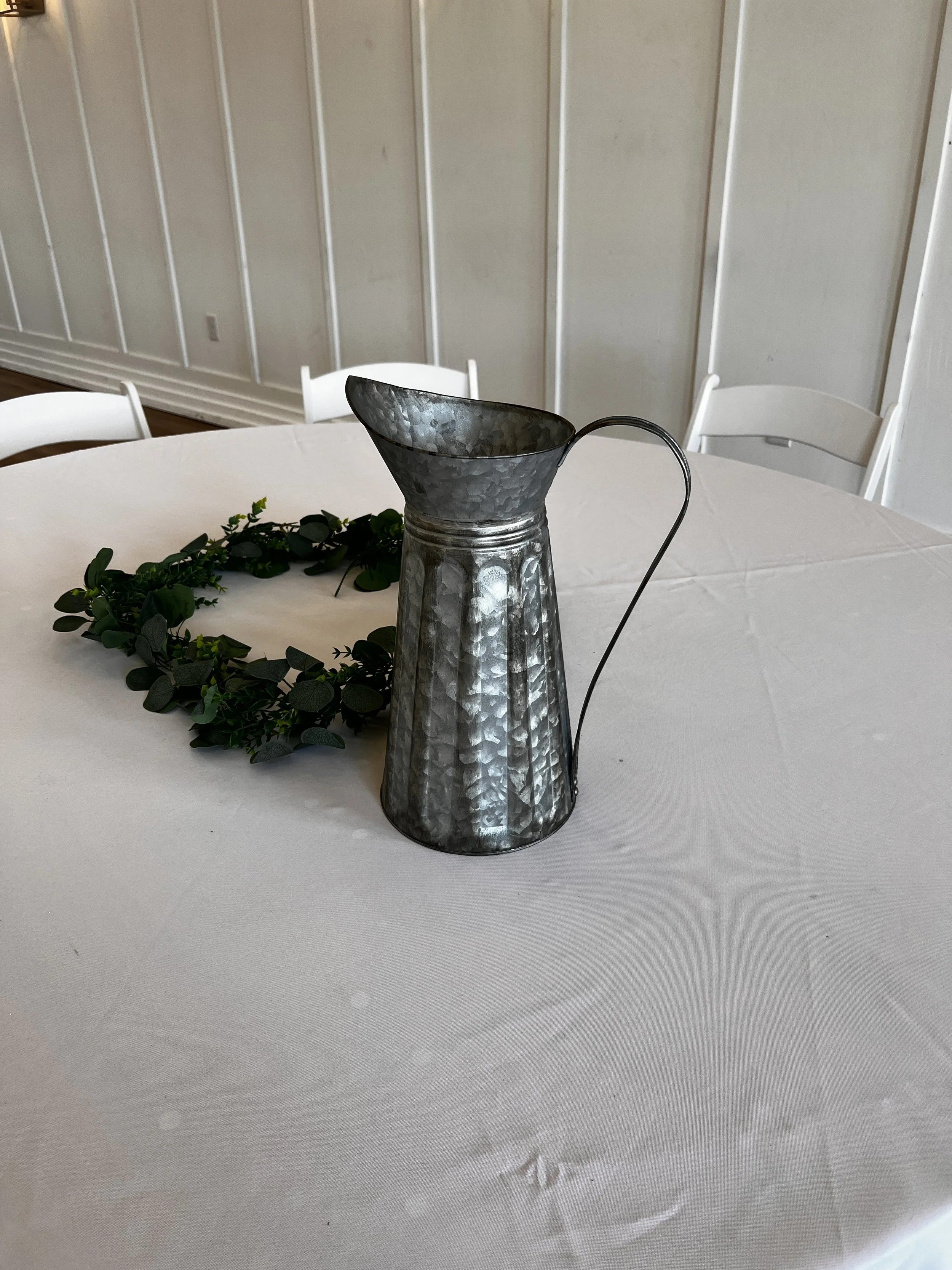 Tall tin pitcher/vase wedding decorations at Charlotte wedding venue