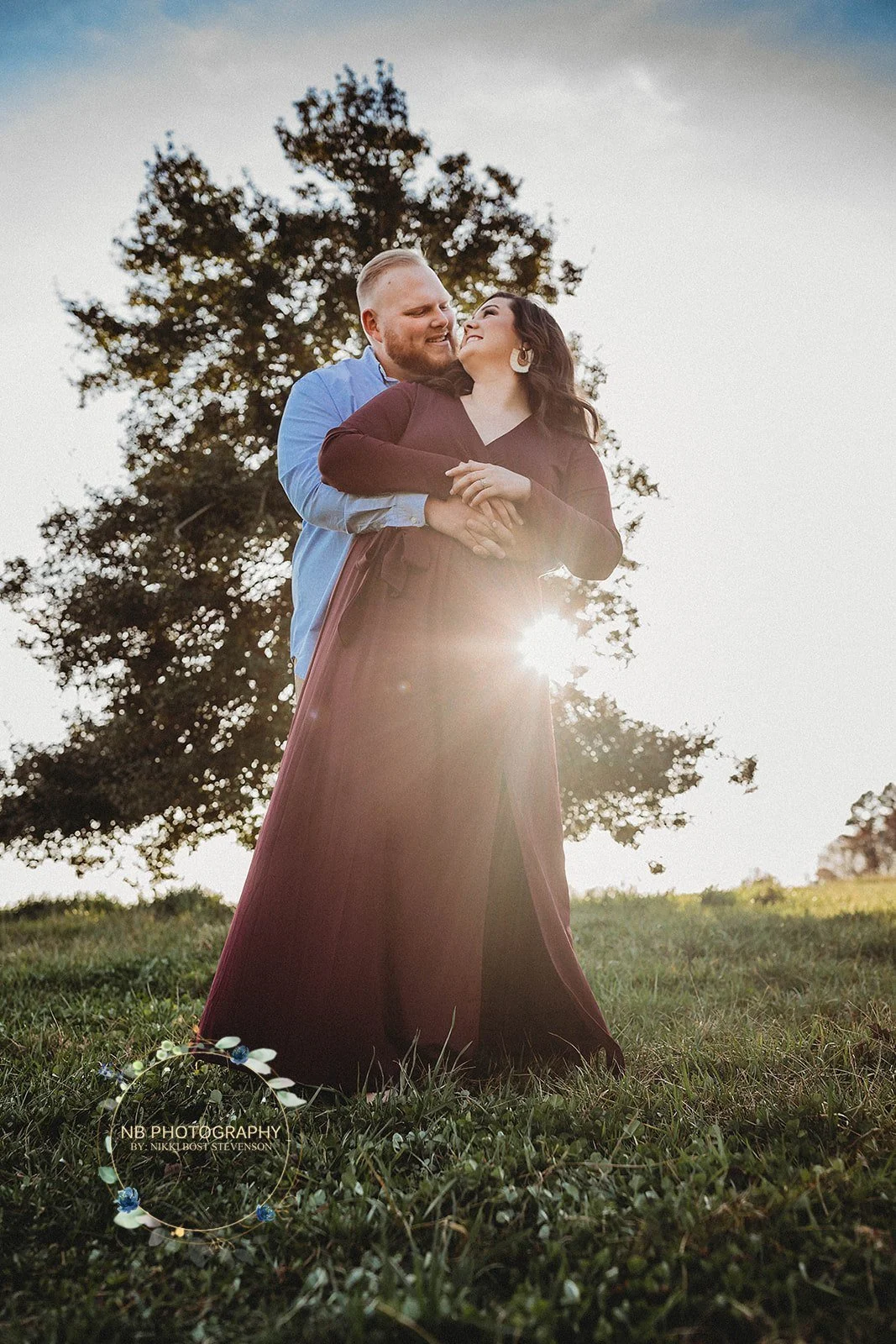Engaged couple embracing at golden hour at Charlotte wedding venue