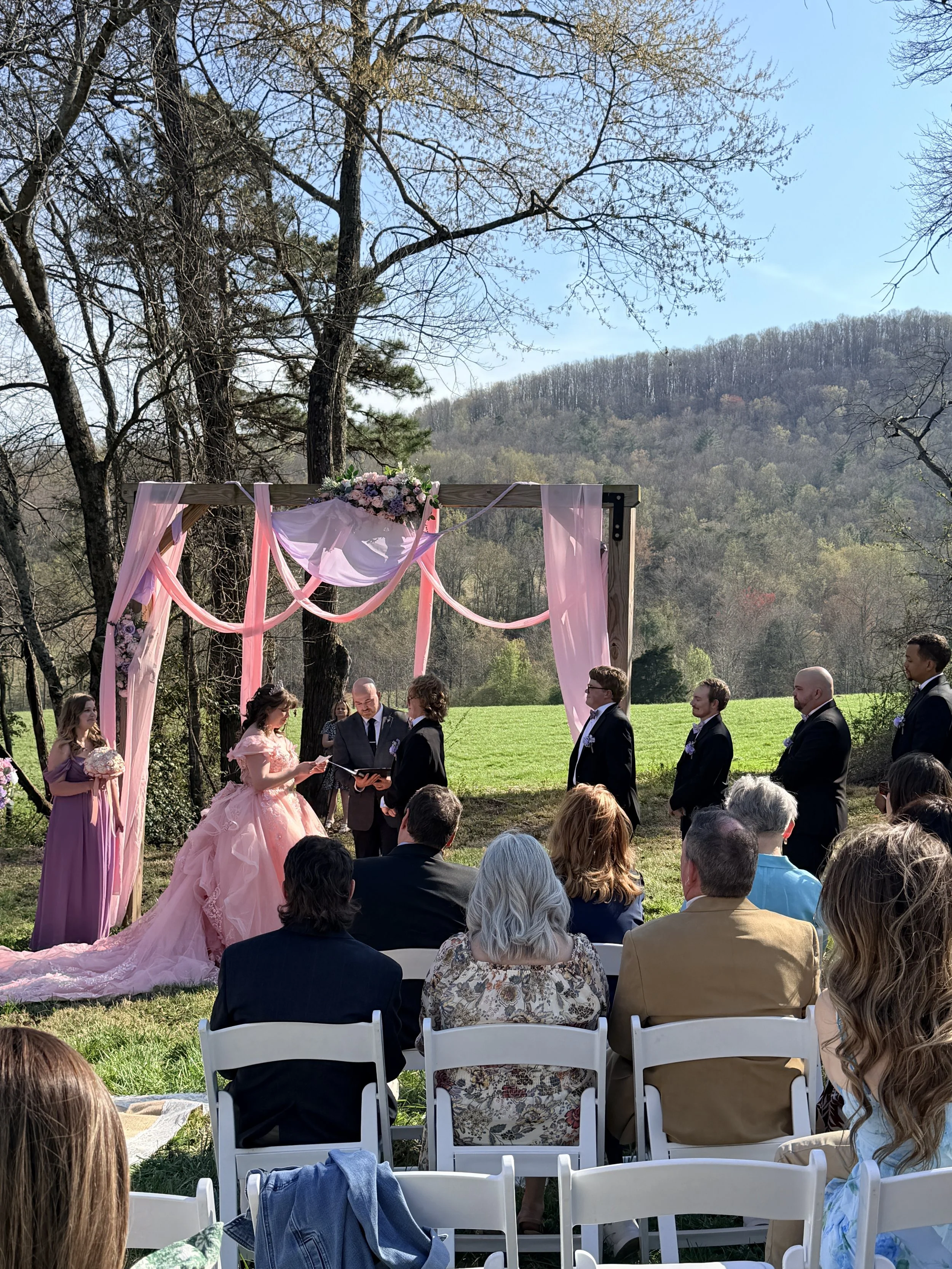 bride and groom exchanging vows at NC Mountain View wedding ceremony; top questions o ask before booking a wedding venue near Charlotte NC