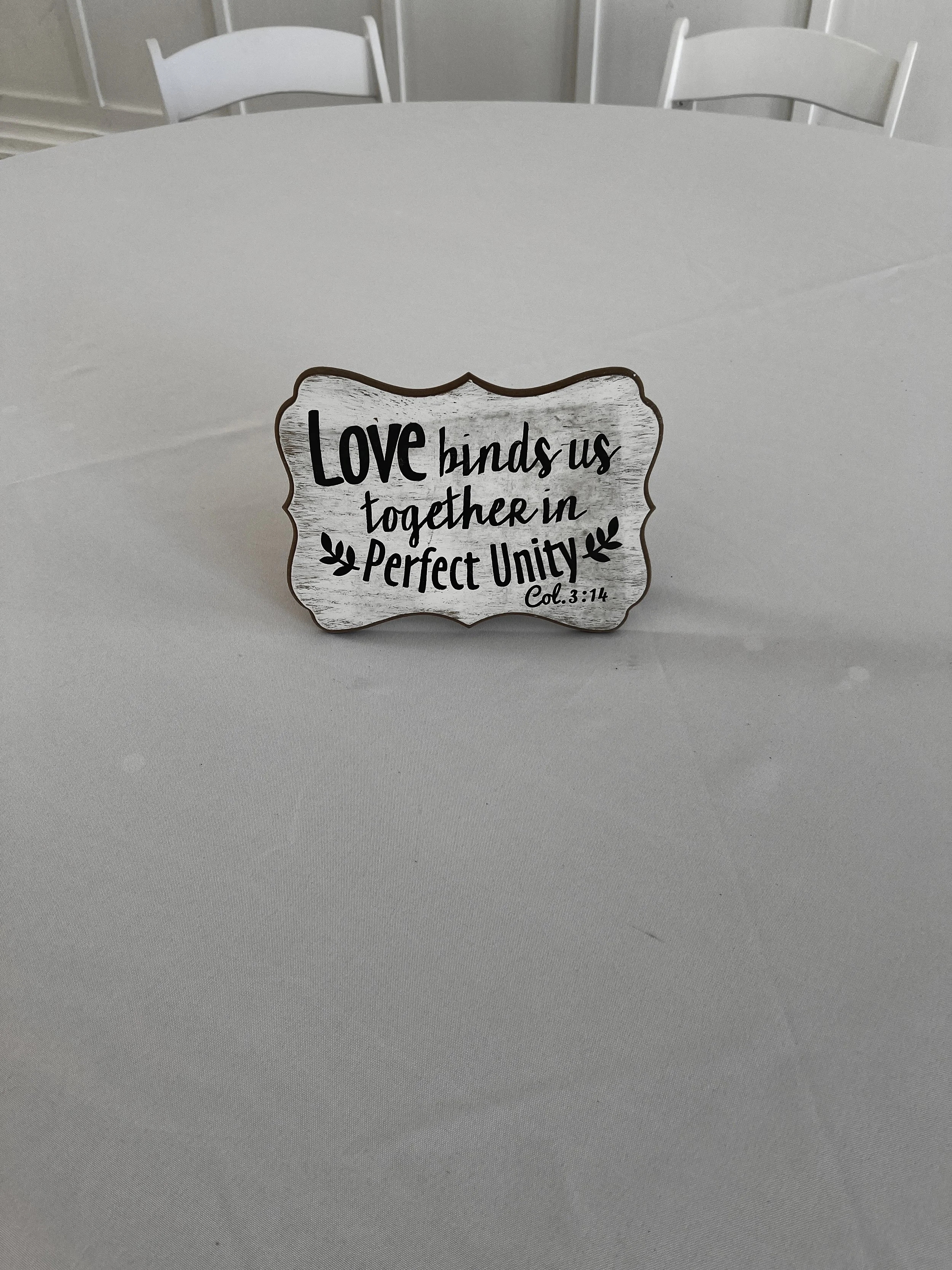 White sign "Love binds us together in perfect unity" for NC wedding