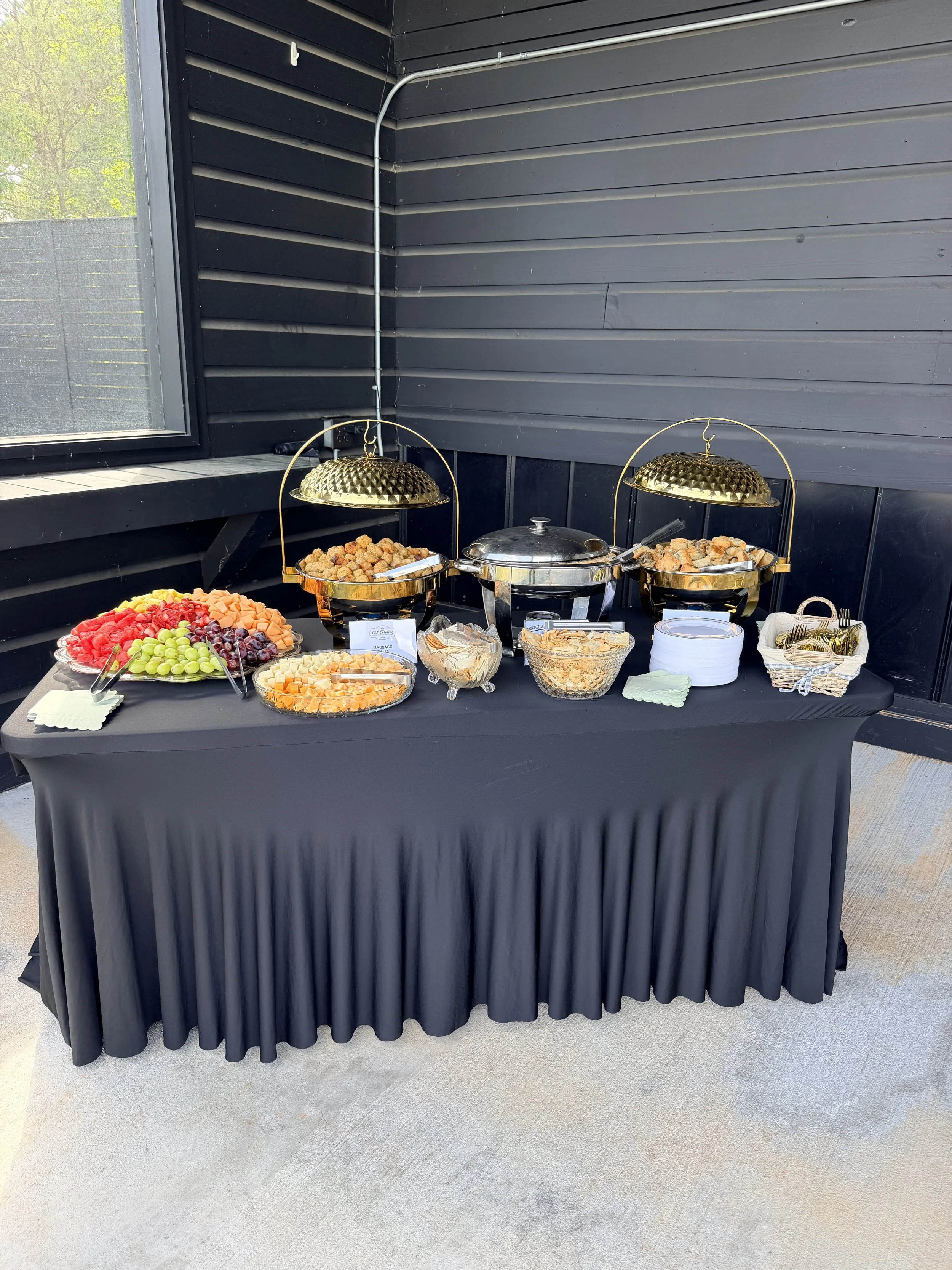 Buffet table with black tablecloth; wellness retreats in NC