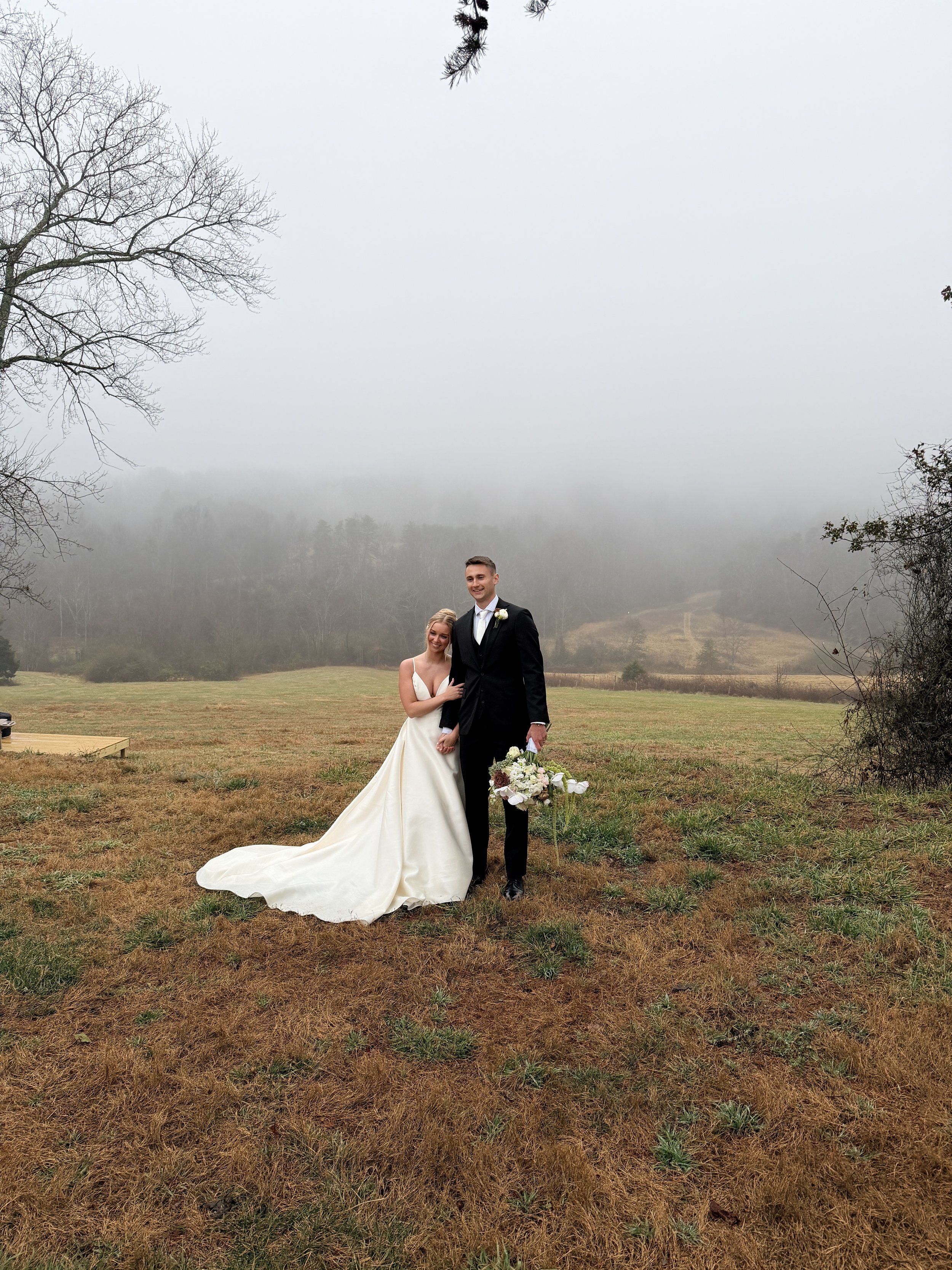bride and groom with moody background at Charlotte wedding venue