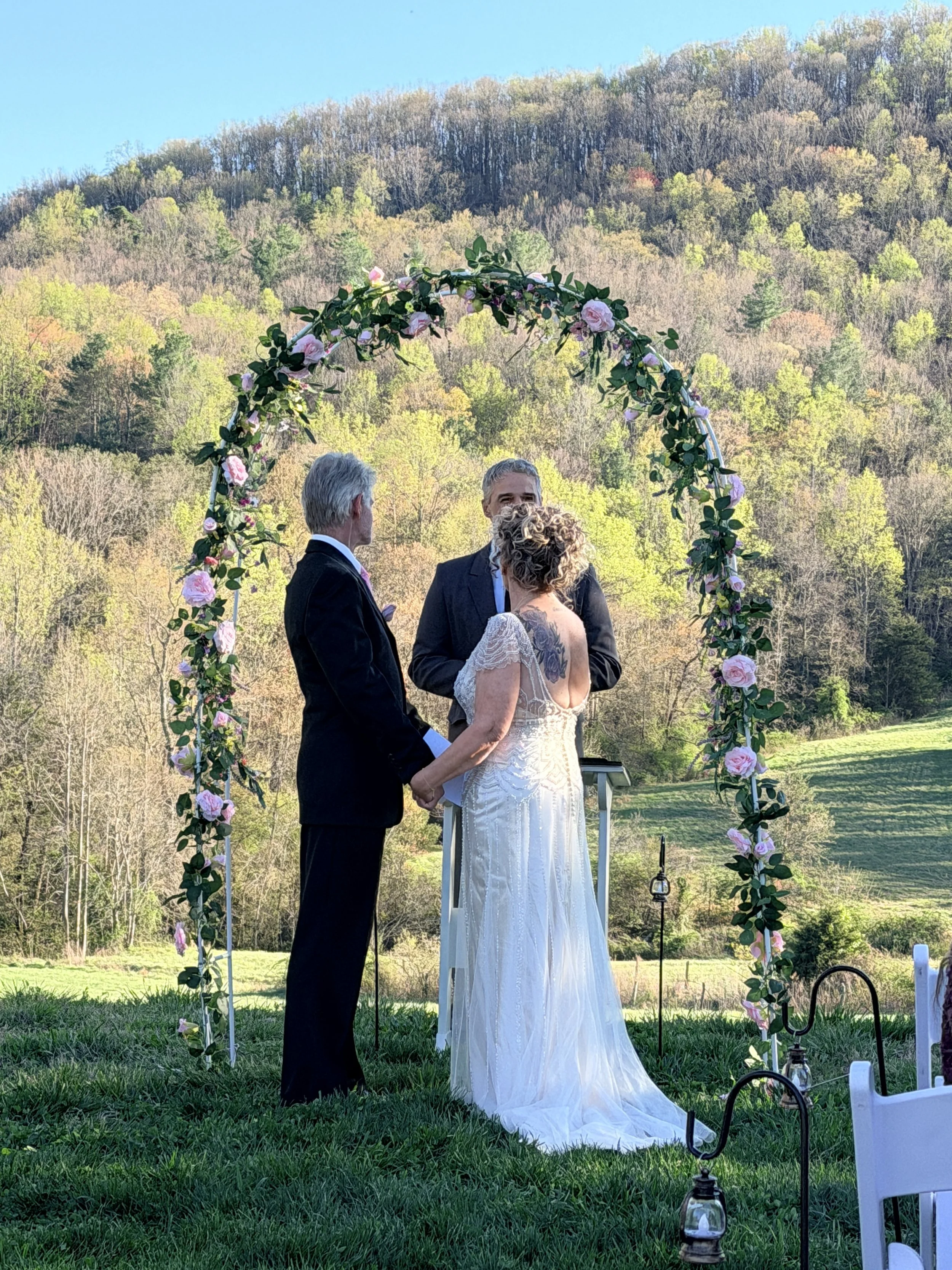 bride and groom vow renewal in front of mountain; how to plan a mountain wedding near Charlotte NC