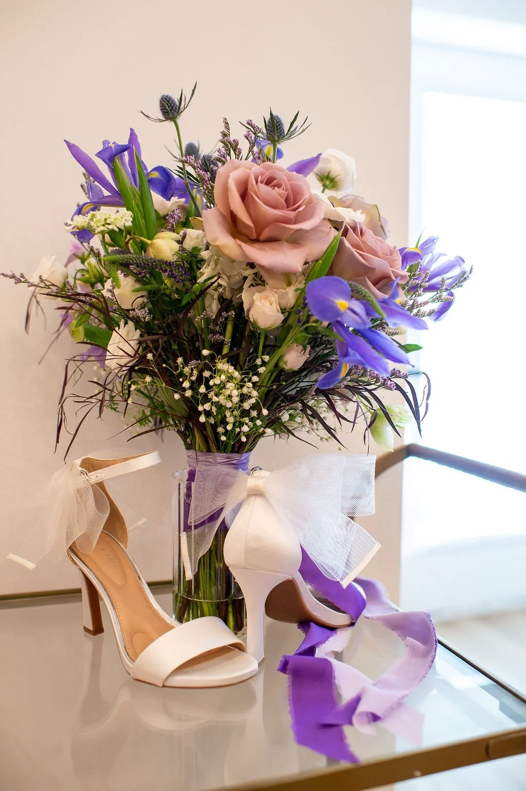 bridal bouquet and shoes at Charlotte wedding venue bridal suite; planning a memorable marriage proposal