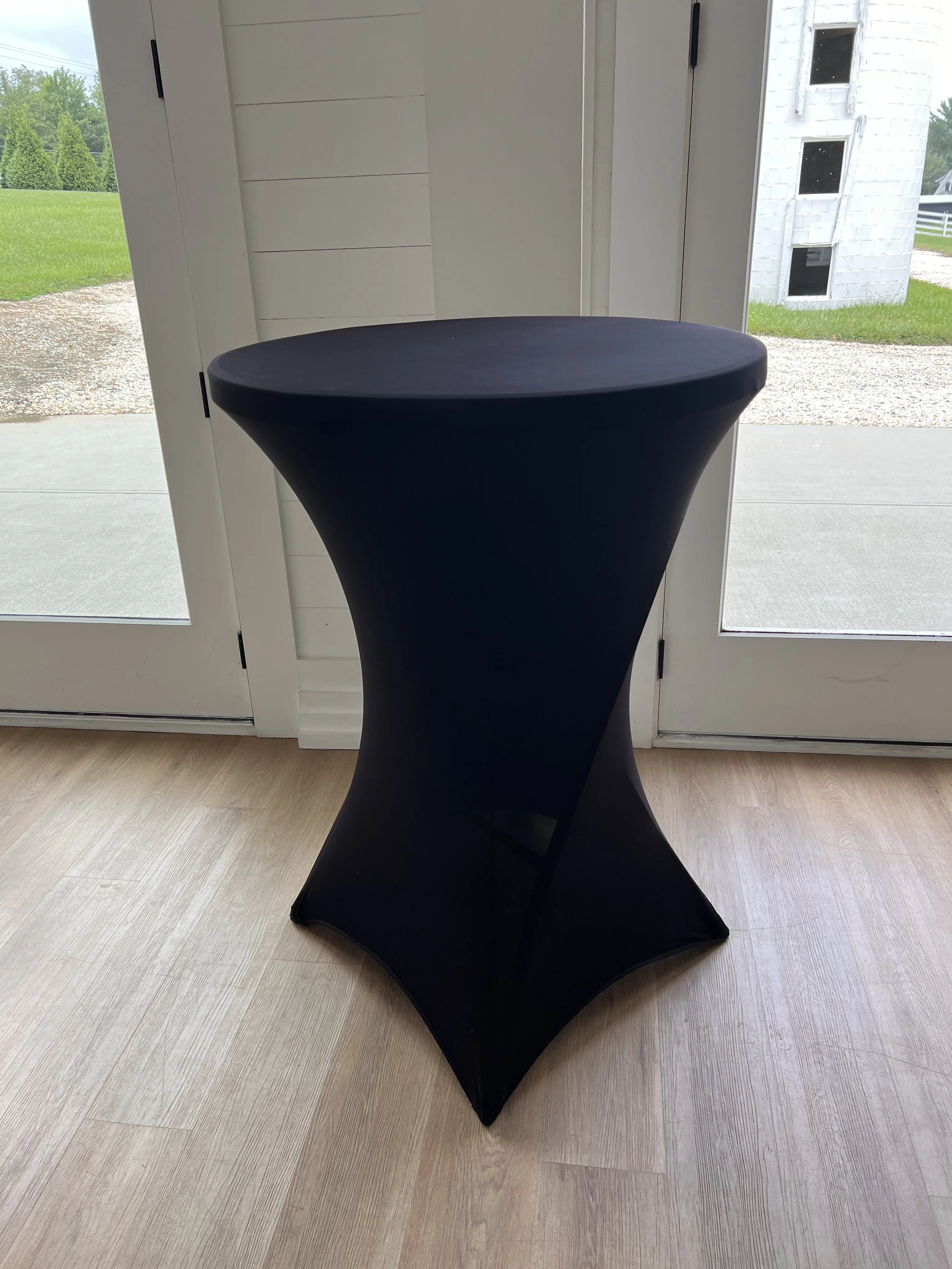Tall cocktail table with black cover for wedding in Charlotte