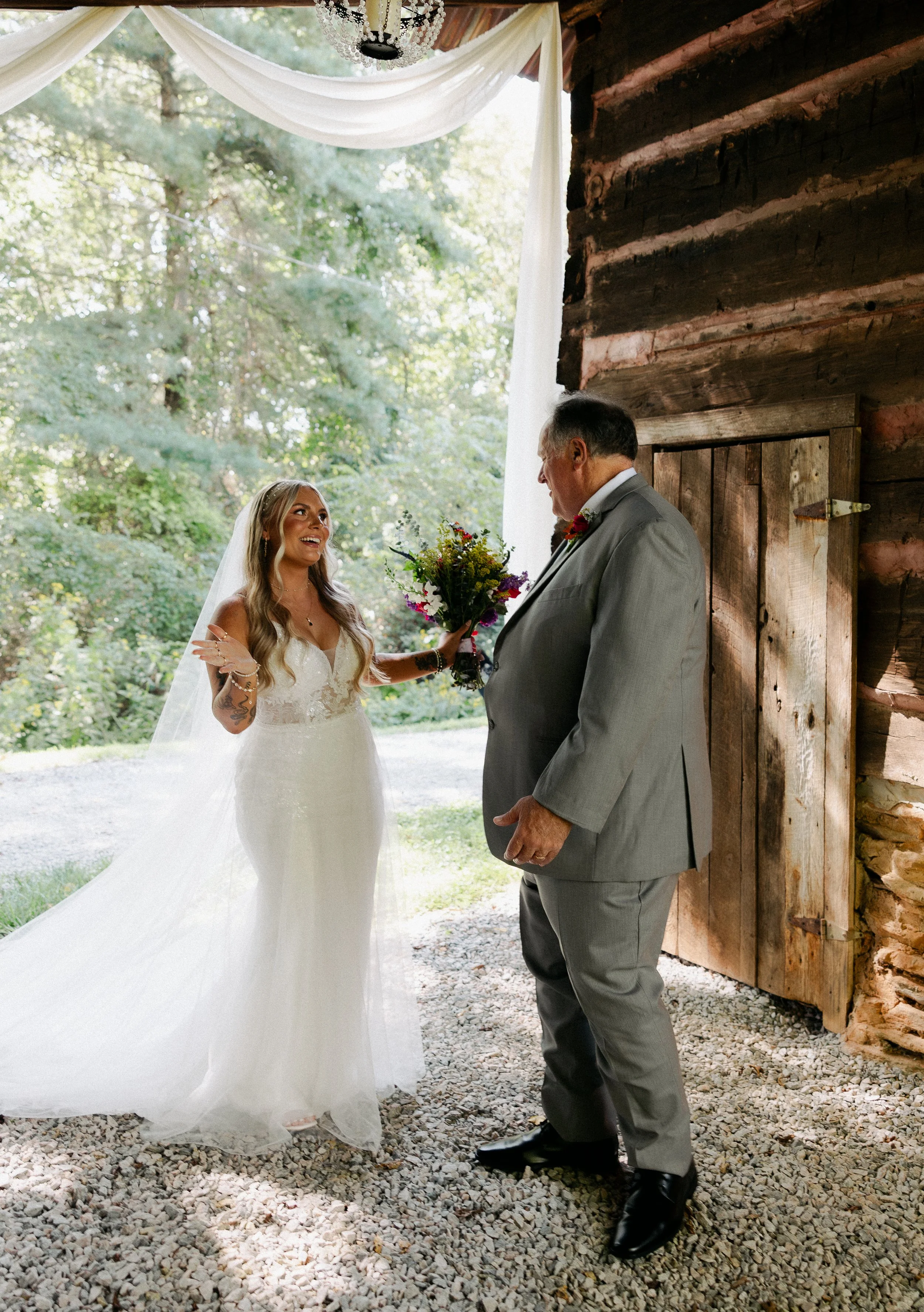bride and dad first look in historic tobacco barn; outdoor wedding. venues near Charlotte NC