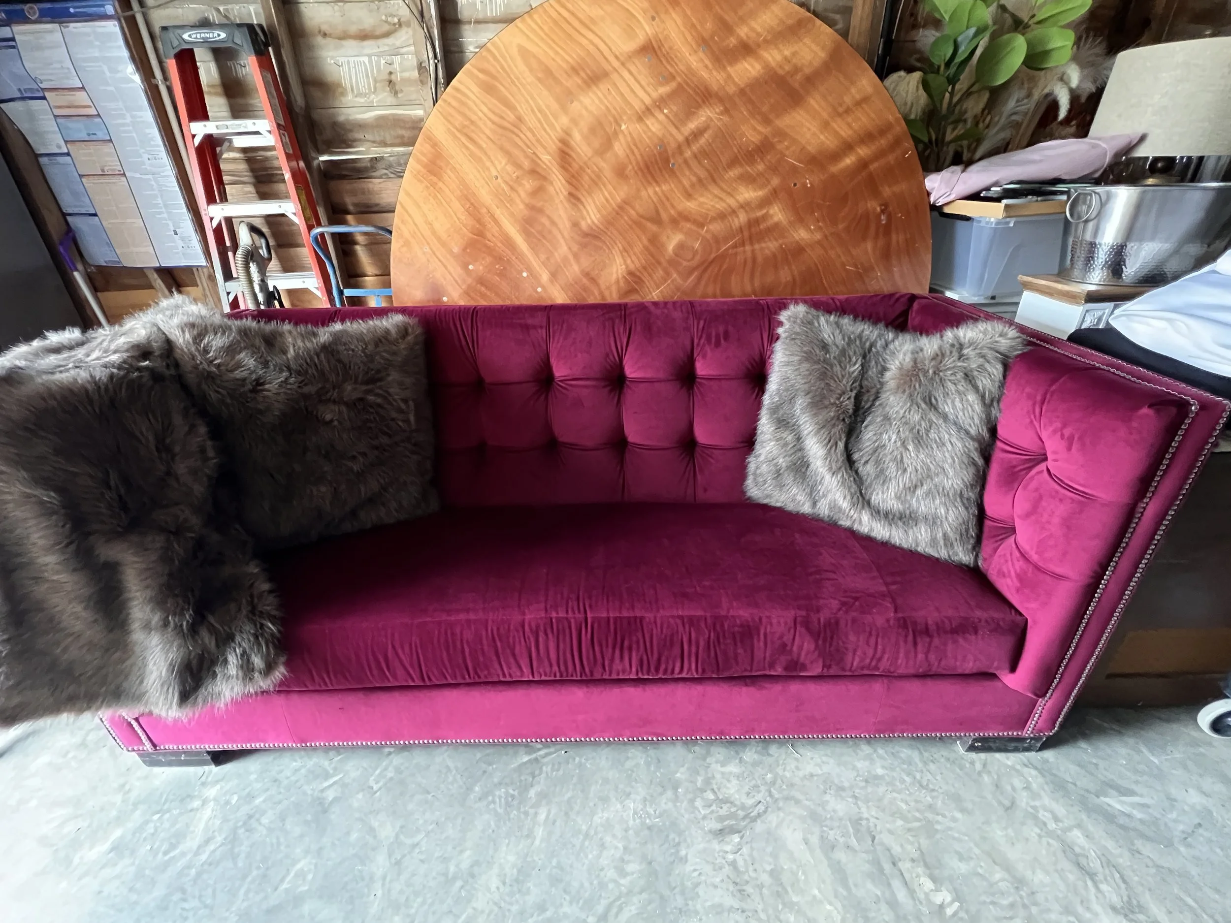 Large red velvet tufted couch