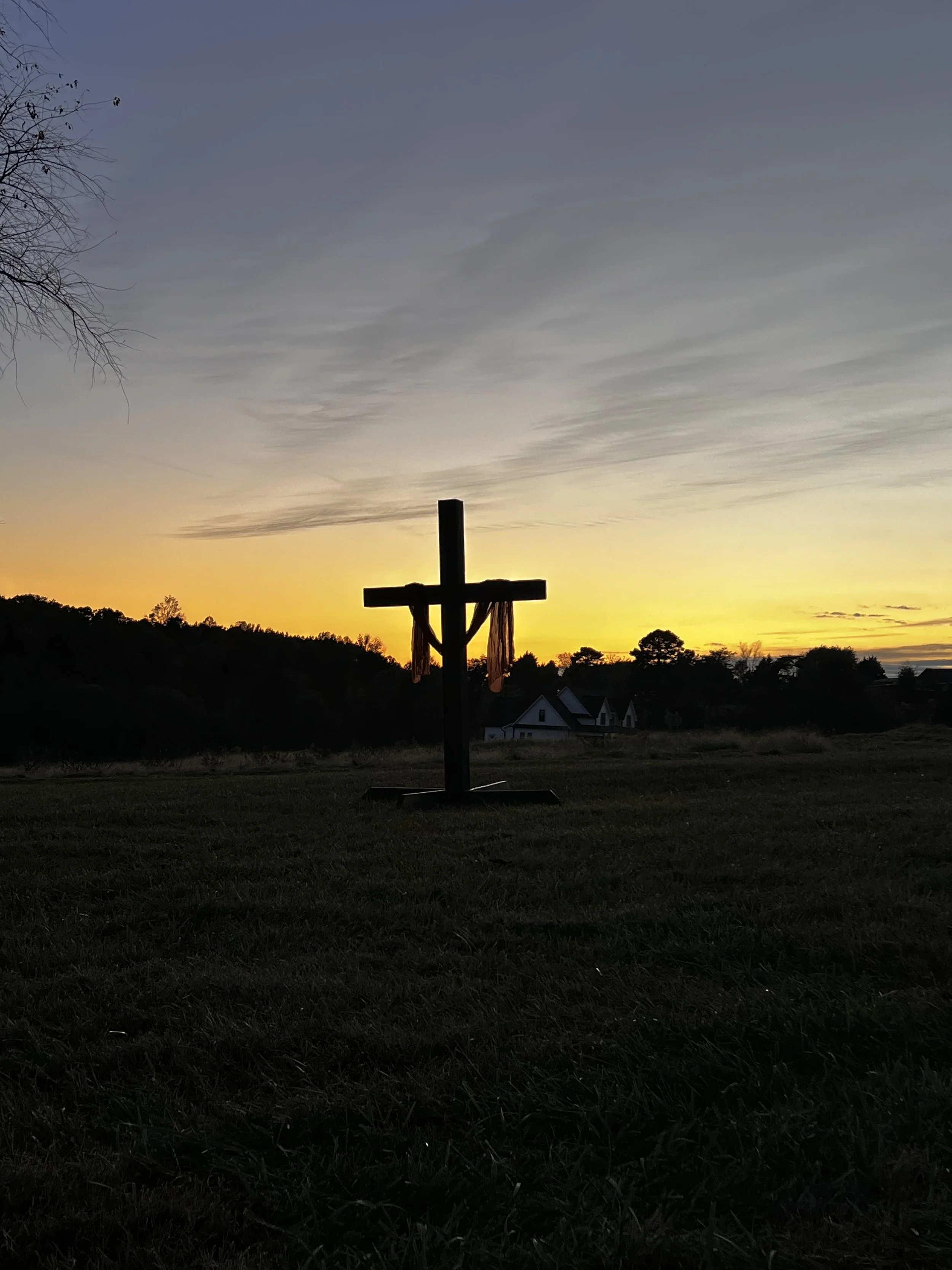 Cross at golden hour at Charlotte wedding venue