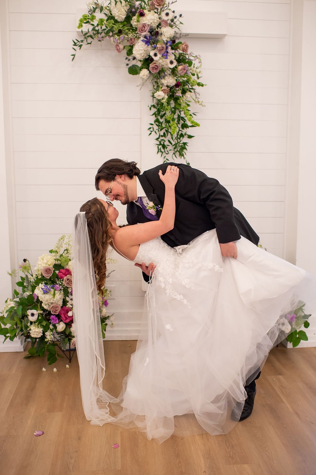 bride and groom dipping at Charlotte wedding venue; planning a memorable marriage proposal