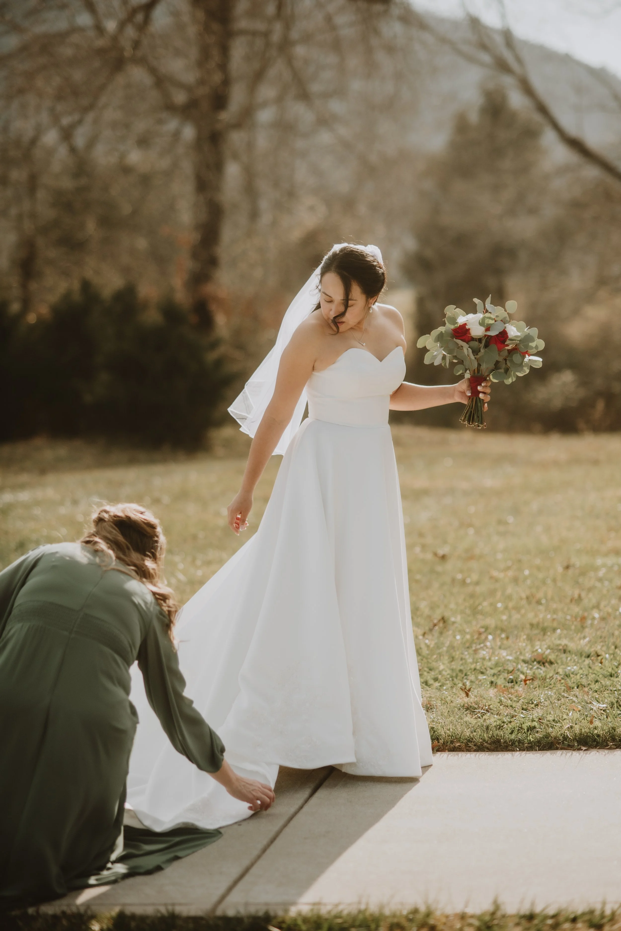 Bride with flowers at Charlotte wedding venue with pricing