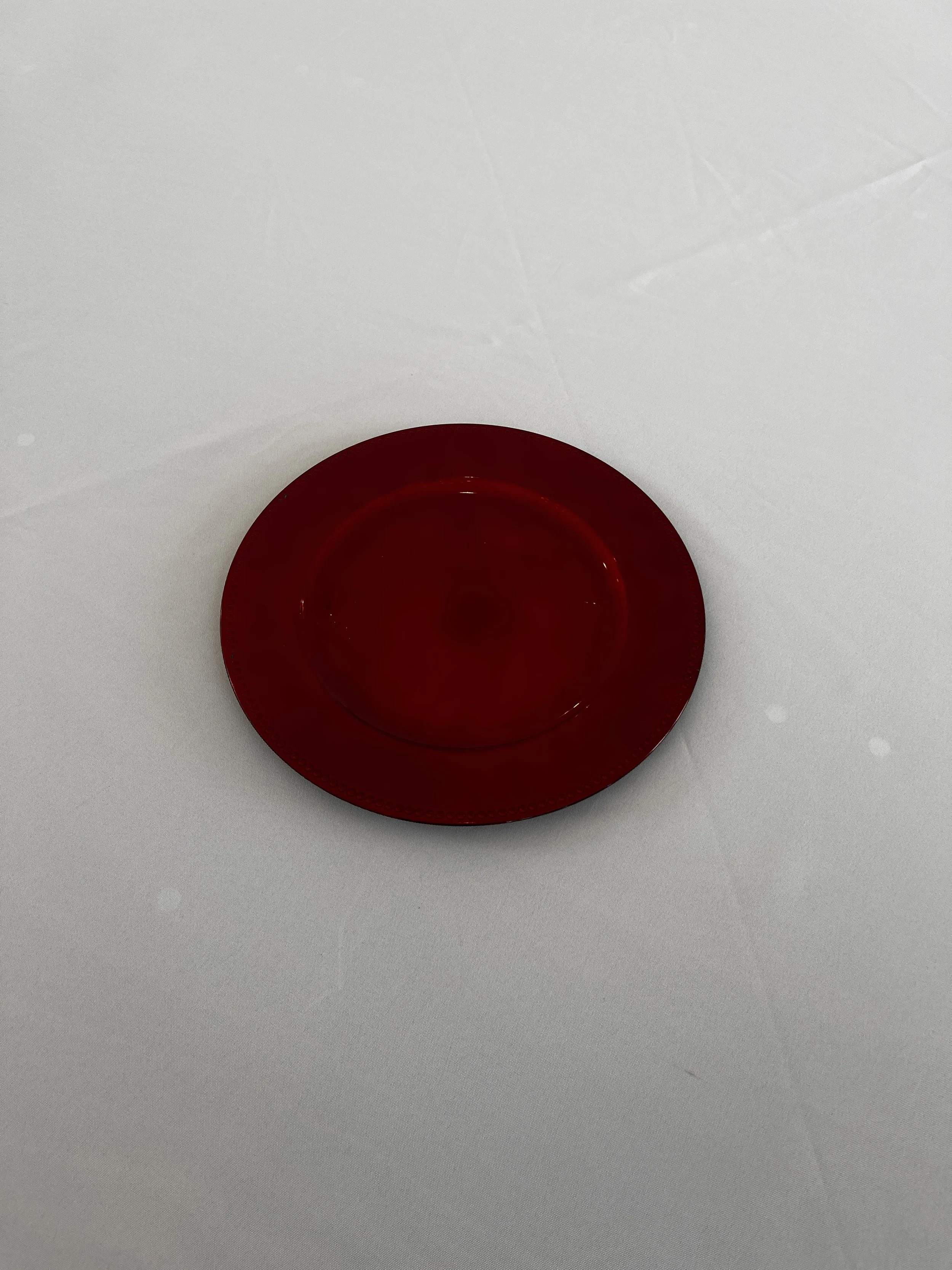 Red charger plate with beaded edge for Charlotte wedding venue