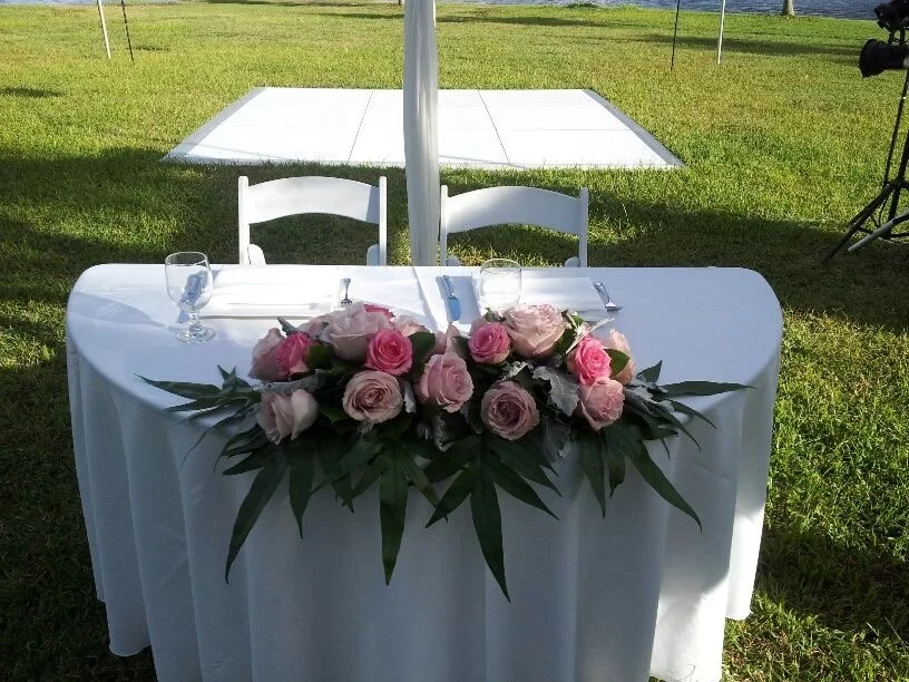Half Round Sweetheart Table with White Tablecloth; wedding venue near Charlotte