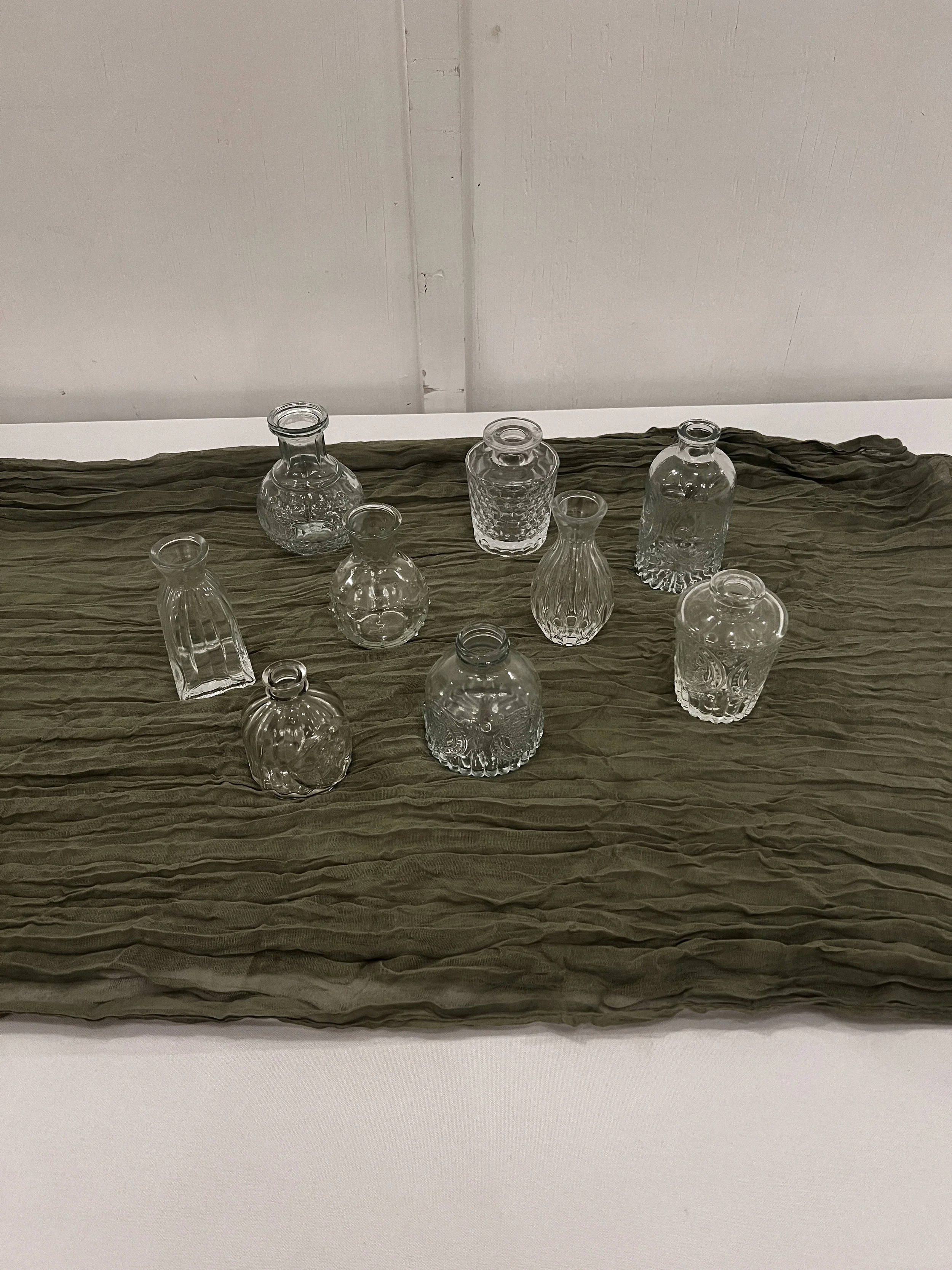 Small clear assorted vases wedding decorations at NC wedding venue