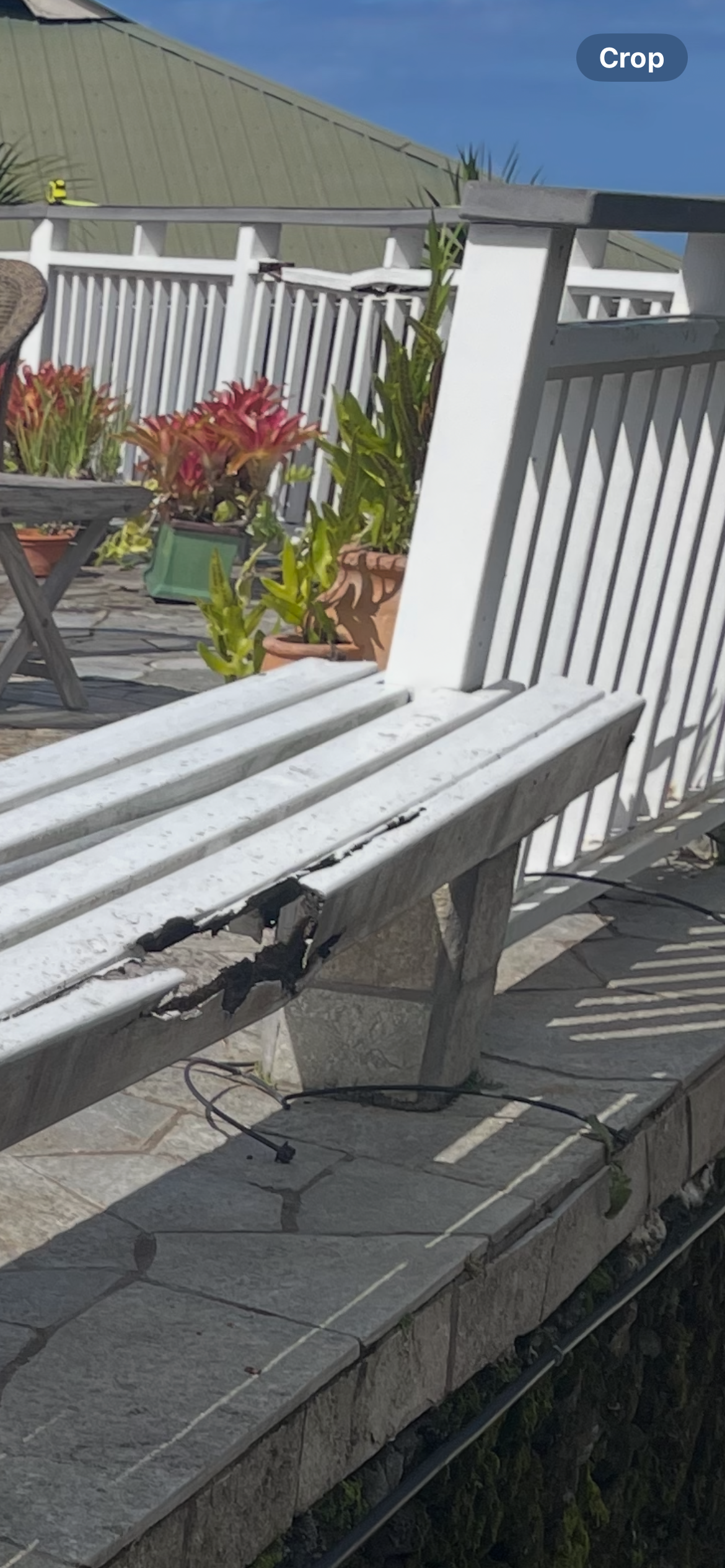 Other angle of rotten bench falling apart